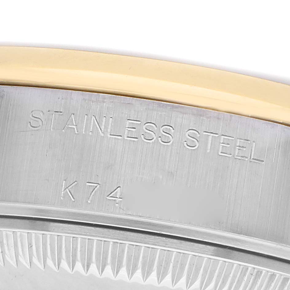 The image shows a close-up of the side of a Rolex Datejust 79163 Women's Steel and Gold (two tone) Silver Dial, focusing on the stainless steel case and part of the bezel.