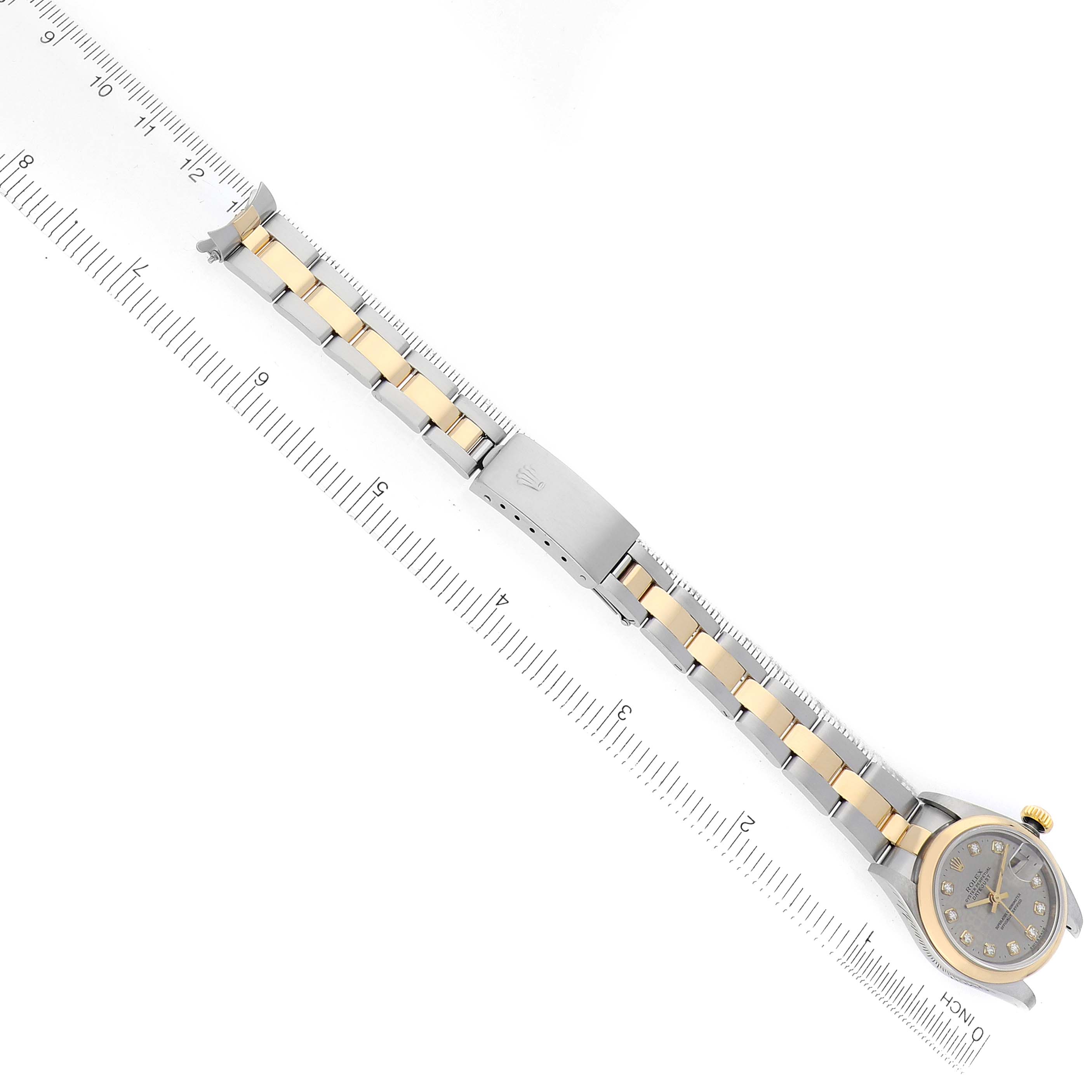 The Rolex Datejust 79163 Women's Steel and Gold (two tone) Silver Dial watch is shown at a slight diagonal angle, displaying the bracelet, clasp, and partial face.