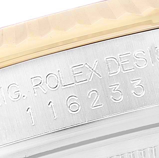 The image shows a close-up of the engraved inner bezel of a Rolex Datejust 116233 Men's Steel and Gold (two tone) Silver Dial, highlighting the model number.