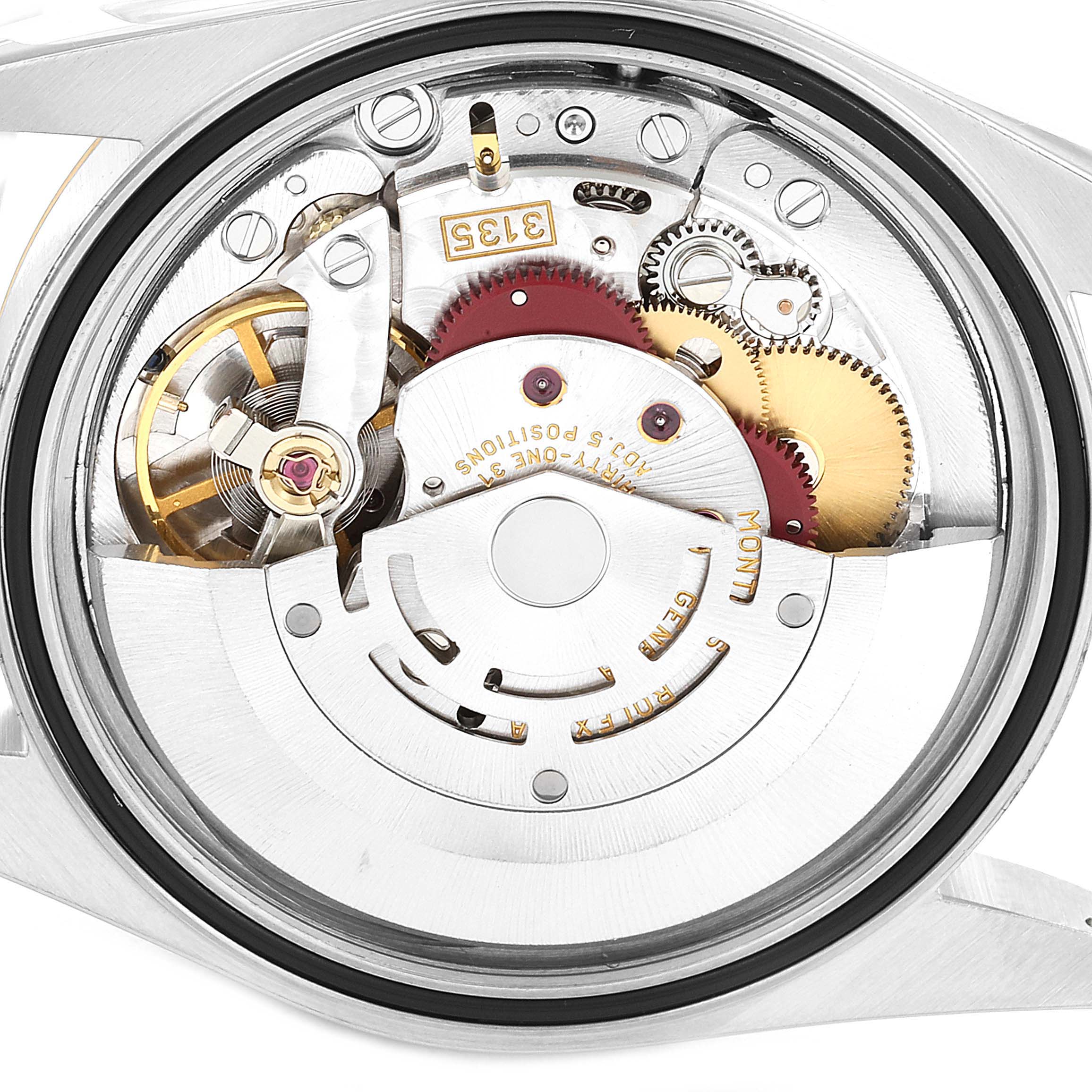 This image shows a close-up view of the Rolex Datejust 16233 Men's Steel and Gold (two tone) Champagne Dial 16233 Men's Steel and Gold (two tone) Champagne Dial's intricate inner movement mechanisms.