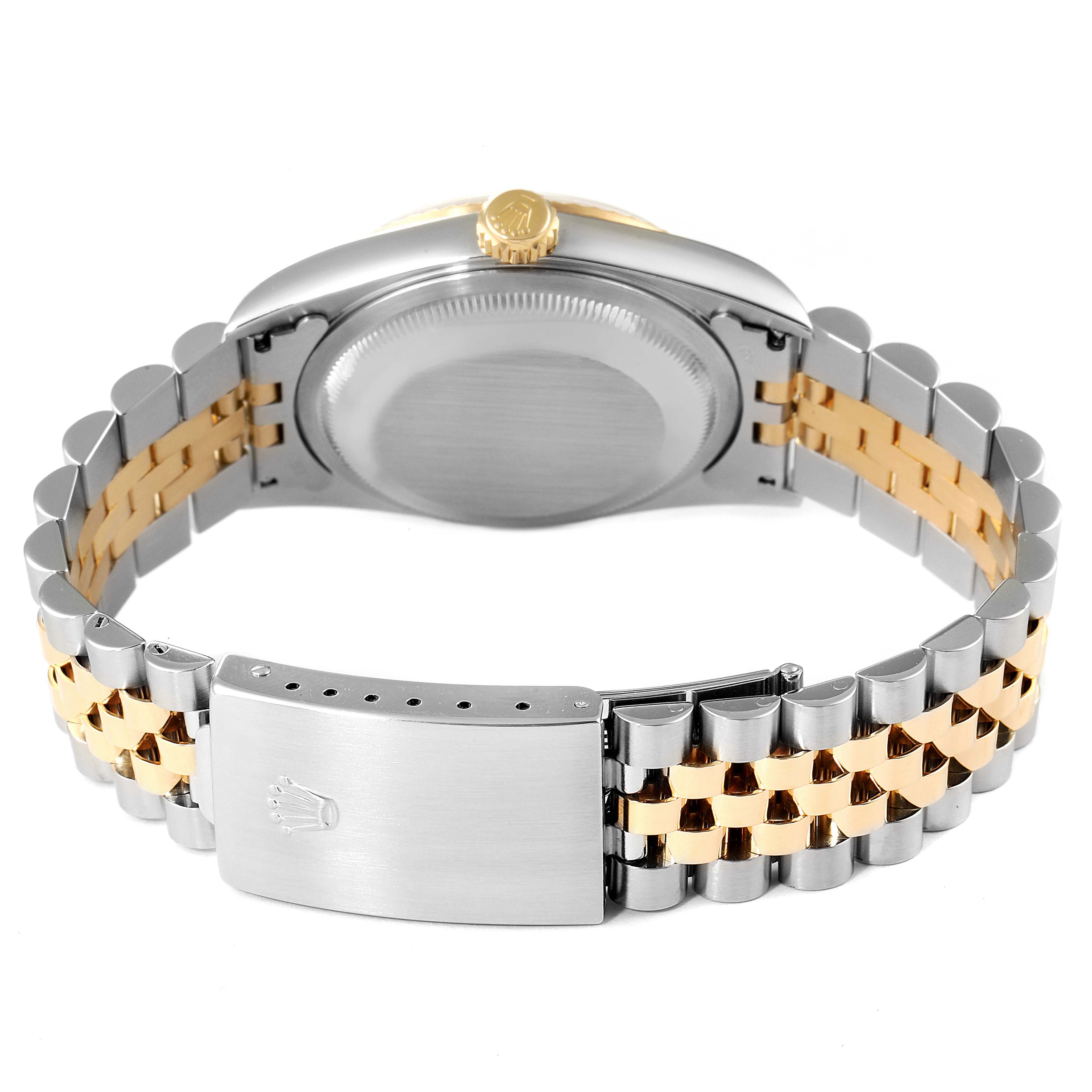 The image shows the back of a Rolex Datejust 16233 Men's Steel and Gold (two tone) Champagne Dial 16233 Men's Steel and Gold (two tone) Champagne Dial watch, highlighting its clasp, bracelet, and case back.