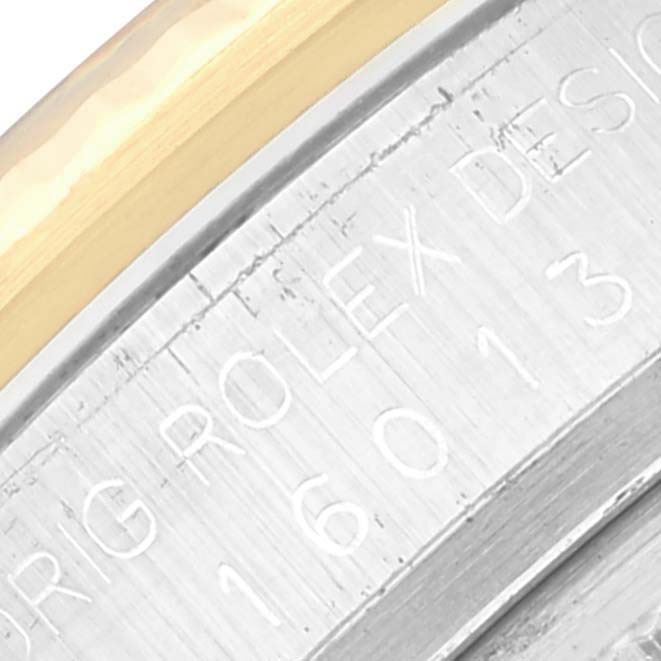 The image shows a close-up of the engravings on the bezel and case of a Rolex Datejust 16013 Men's Stainless Steel White Dial 16013 Men's Stainless Steel White Dial watch.