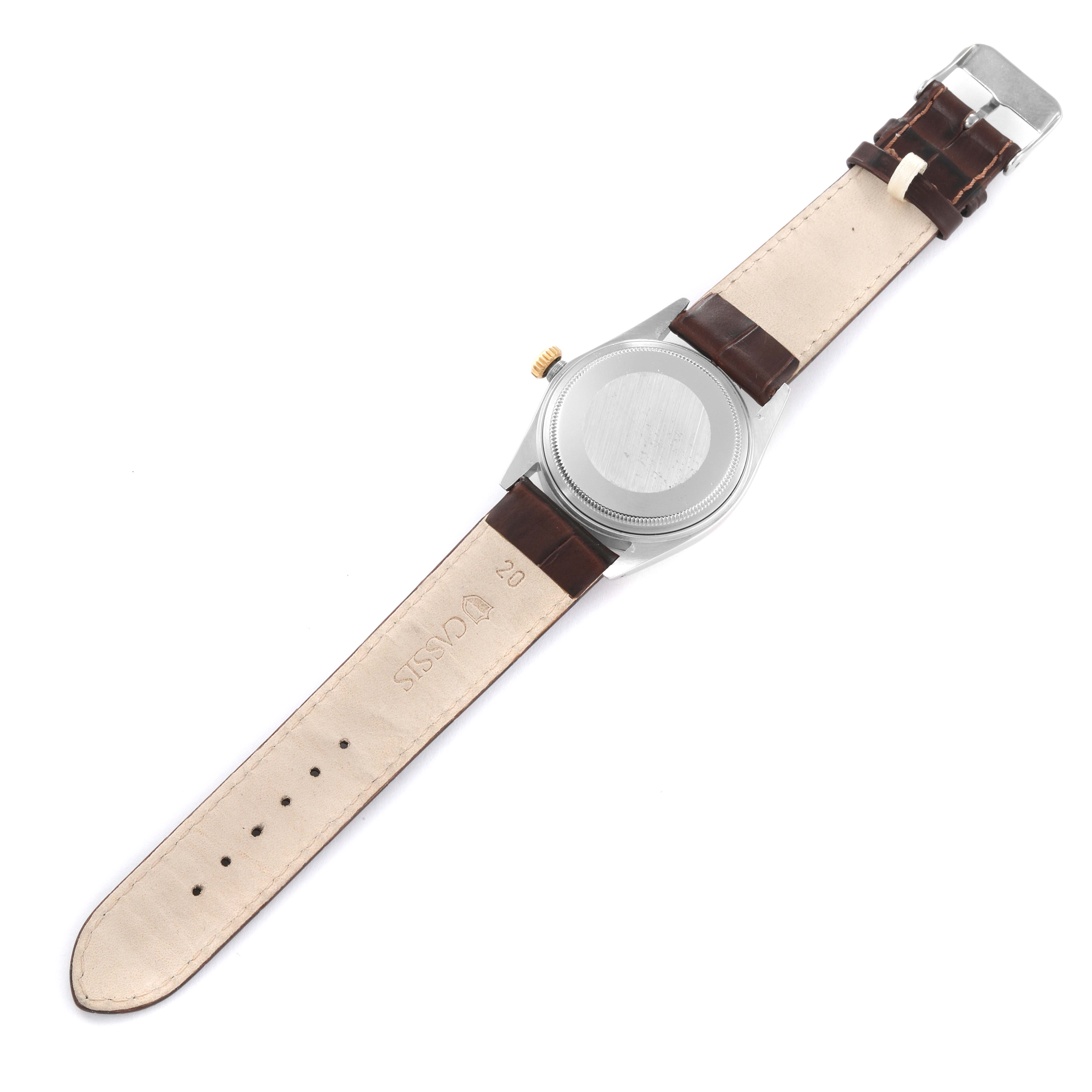 The image shows the back view of a Rolex Datejust 16013 Men's Stainless Steel White Dial 16013 Men's Stainless Steel White Dial watch with leather straps fully extended.