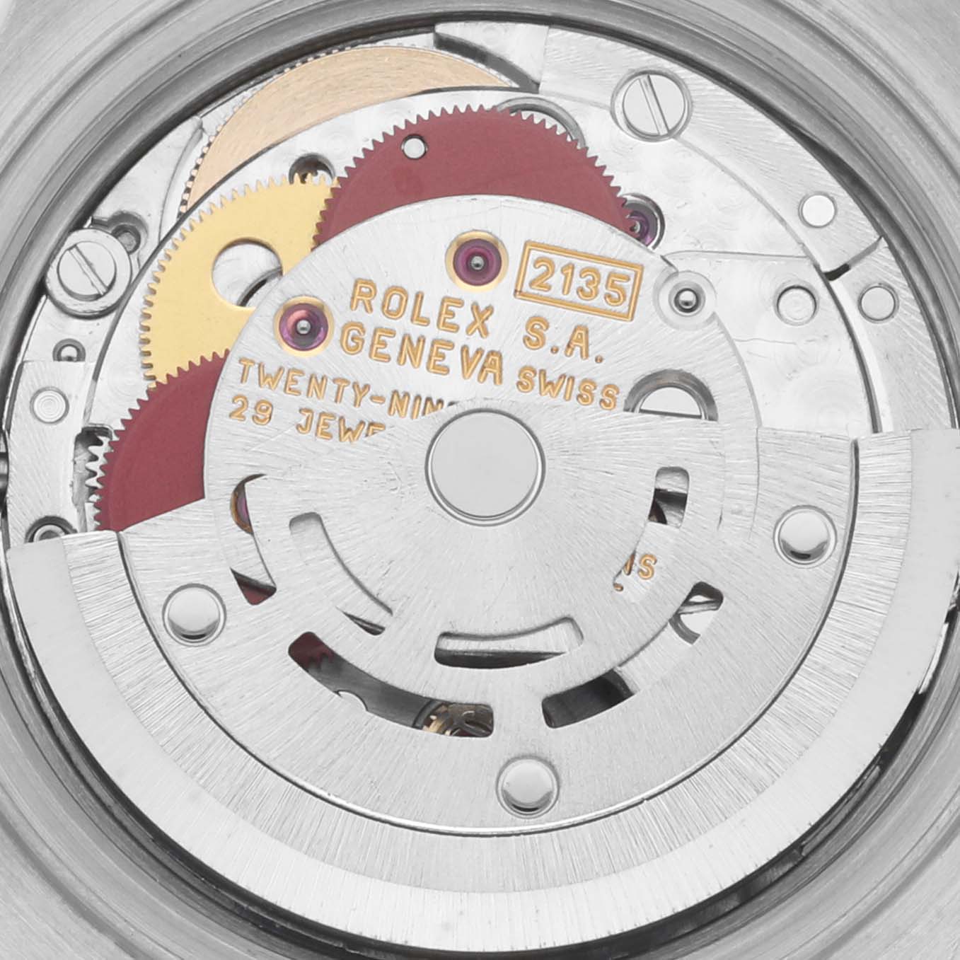 The image shows a close-up of the Rolex Datejust 69173 Women's Steel and Gold (two tone) White Dial 69173 Women's Steel and Gold (two tone) White Dial's intricate movement and gears from a back-angle view.