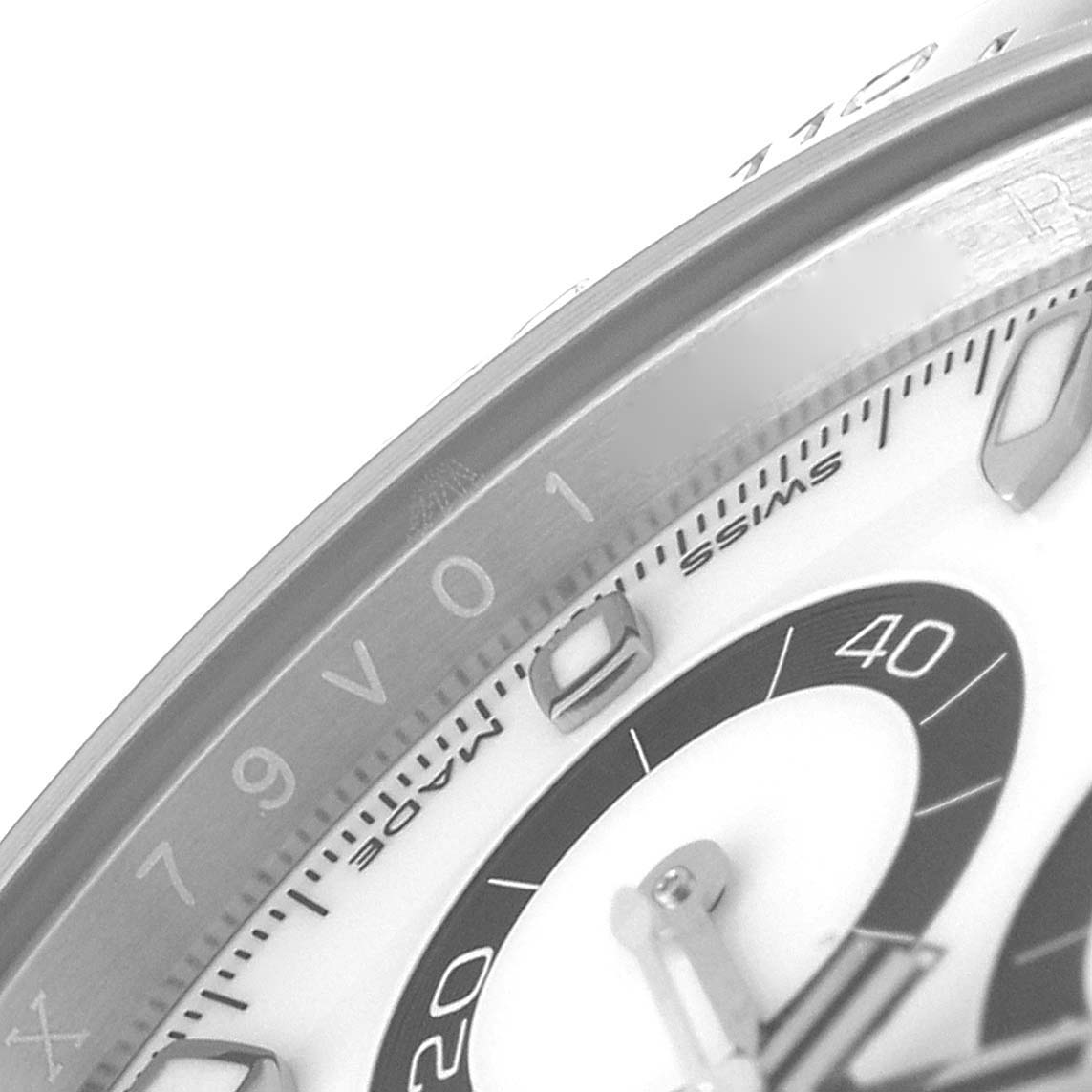 The image shows a close-up of the dial and bezel of a Rolex Daytona 116500 Men's Stainless Steel White Dial 116500 Men's Stainless Steel White Dial watch, highlighting the markers and part of the sub-dial.