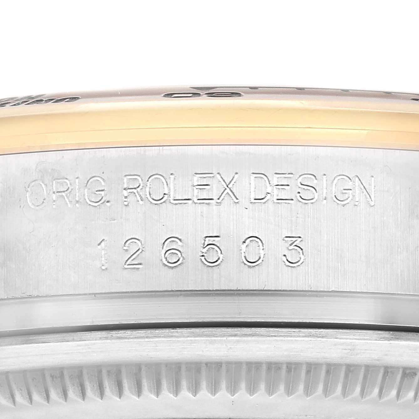 The image shows a close-up of the side of a Rolex Daytona 126503 Men's Steel and Gold (two tone) Black Dial, focusing on the model number engraving.