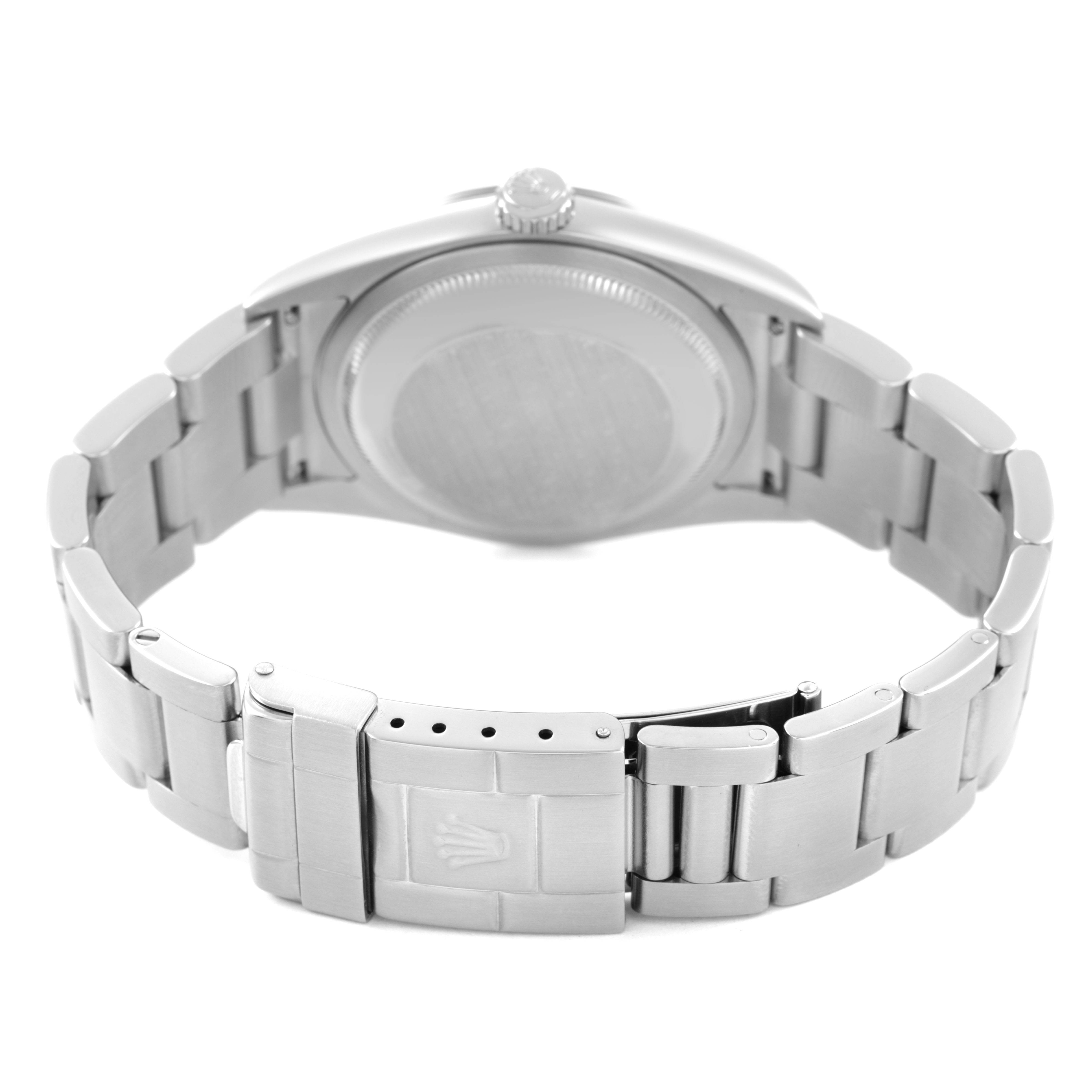 The image shows the back of the Rolex Explorer 114270 Men's Stainless Steel Black Dial watch, highlighting the case back and bracelet clasp.