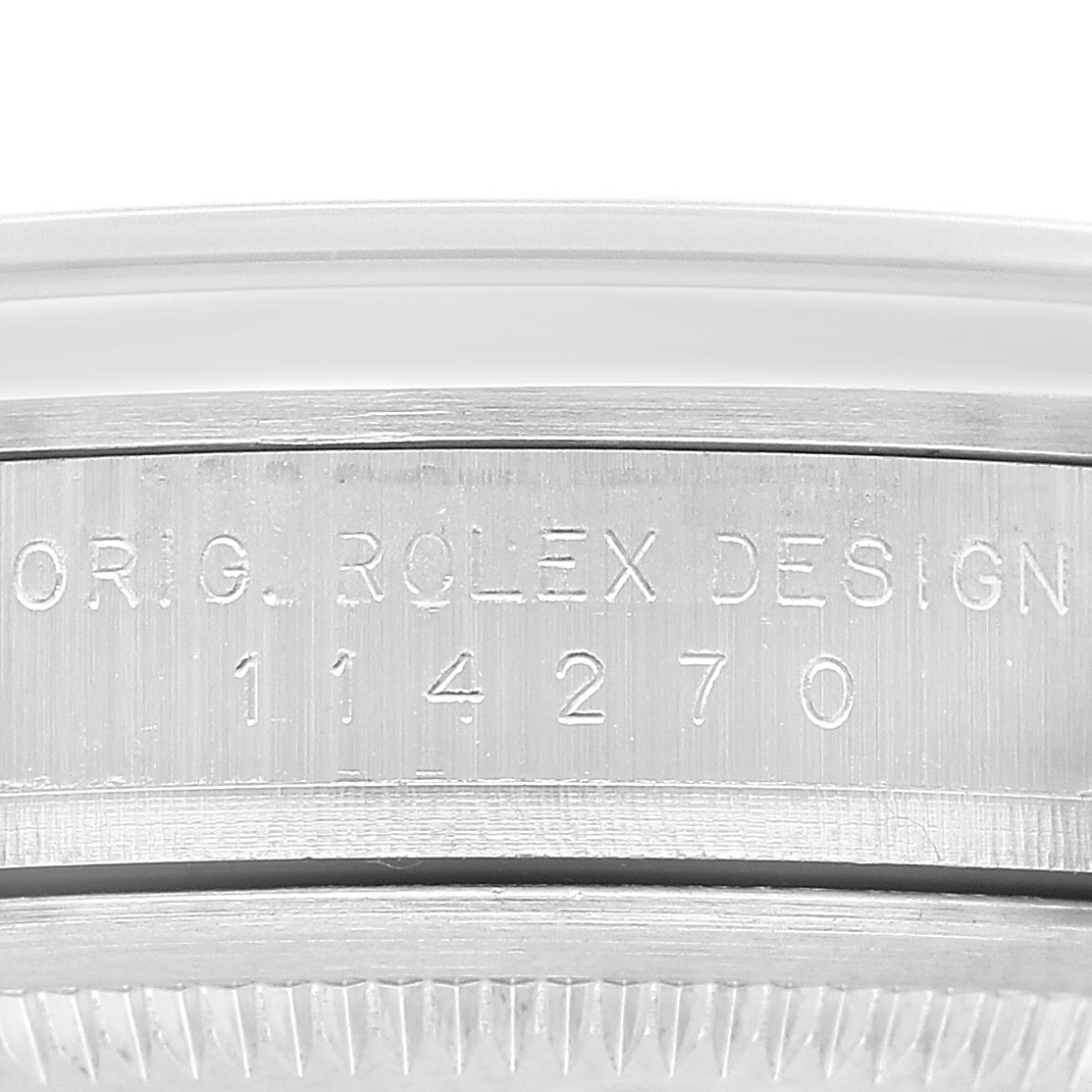 The image shows a close-up side view of the Rolex Explorer 114270 Men's Stainless Steel Black Dial, focusing on the engraved model number.