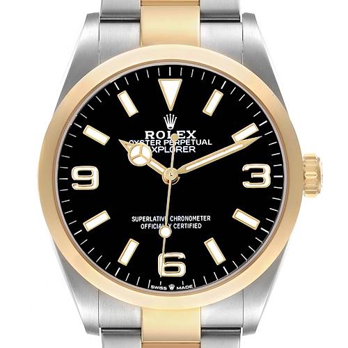 The Rolex Explorer 124273 Men's Steel and Gold (two tone) Black Dial watch is shown from the front, highlighting the face, bezel, and part of the bracelet.