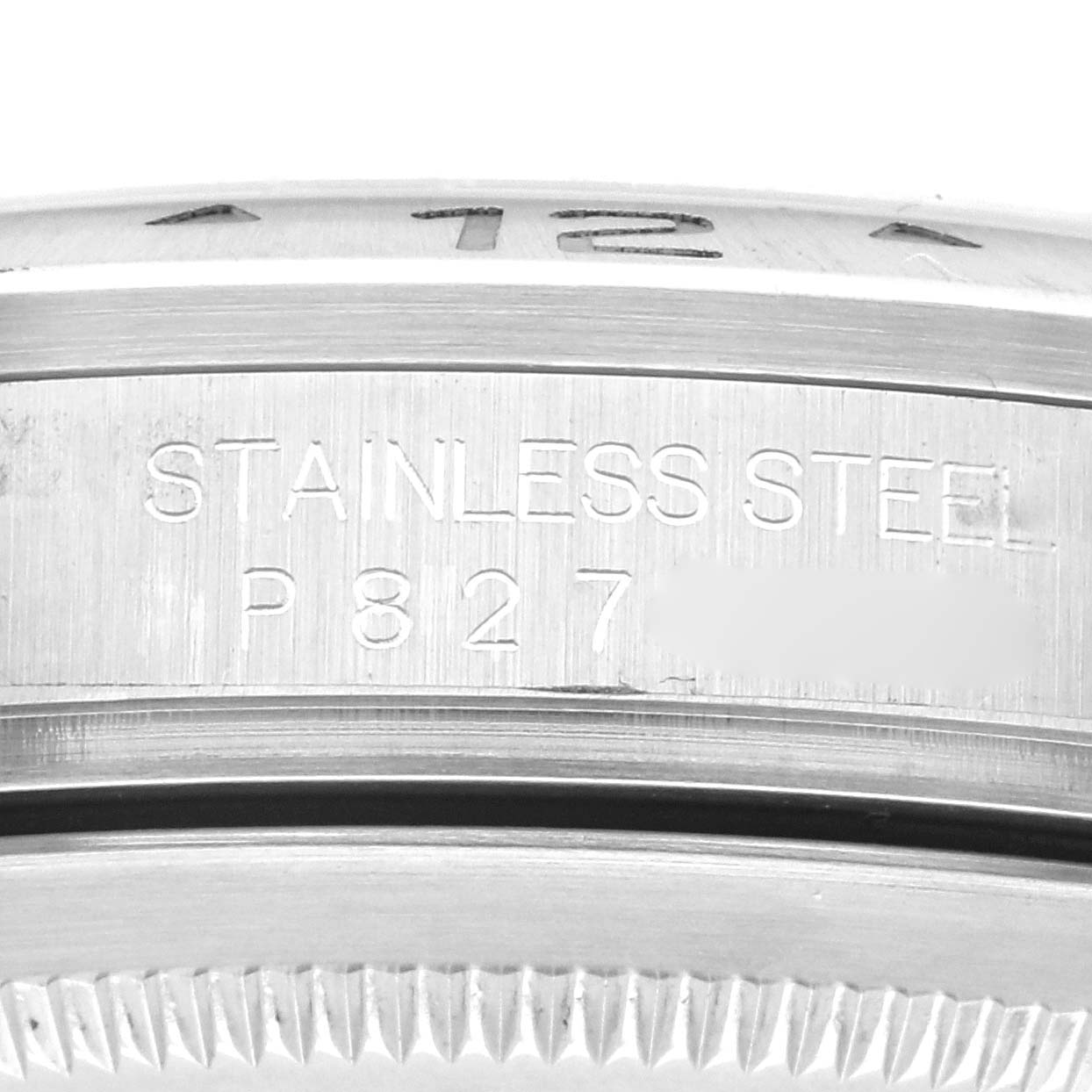 The image shows a close-up of the case edge and engraving of the Rolex Explorer 16570 Men's Stainless Steel White Dial 16570 Men's Stainless Steel White Dial watch.