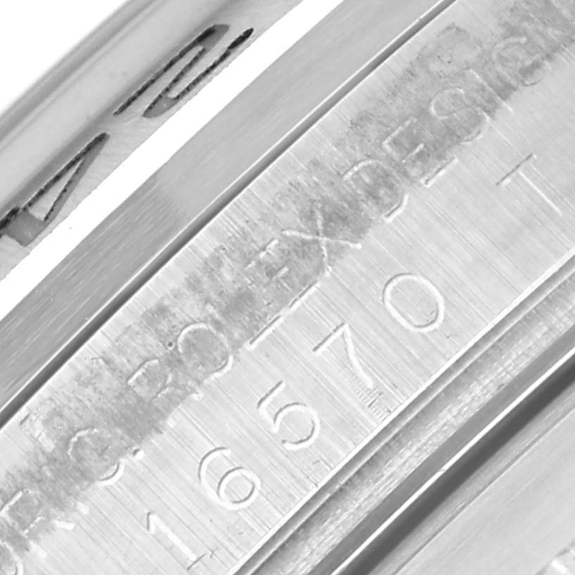The image shows a close-up of the inner bezel, with engravings of the Rolex Explorer 16570 Men's Stainless Steel White Dial 16570 Men's Stainless Steel White Dial model.