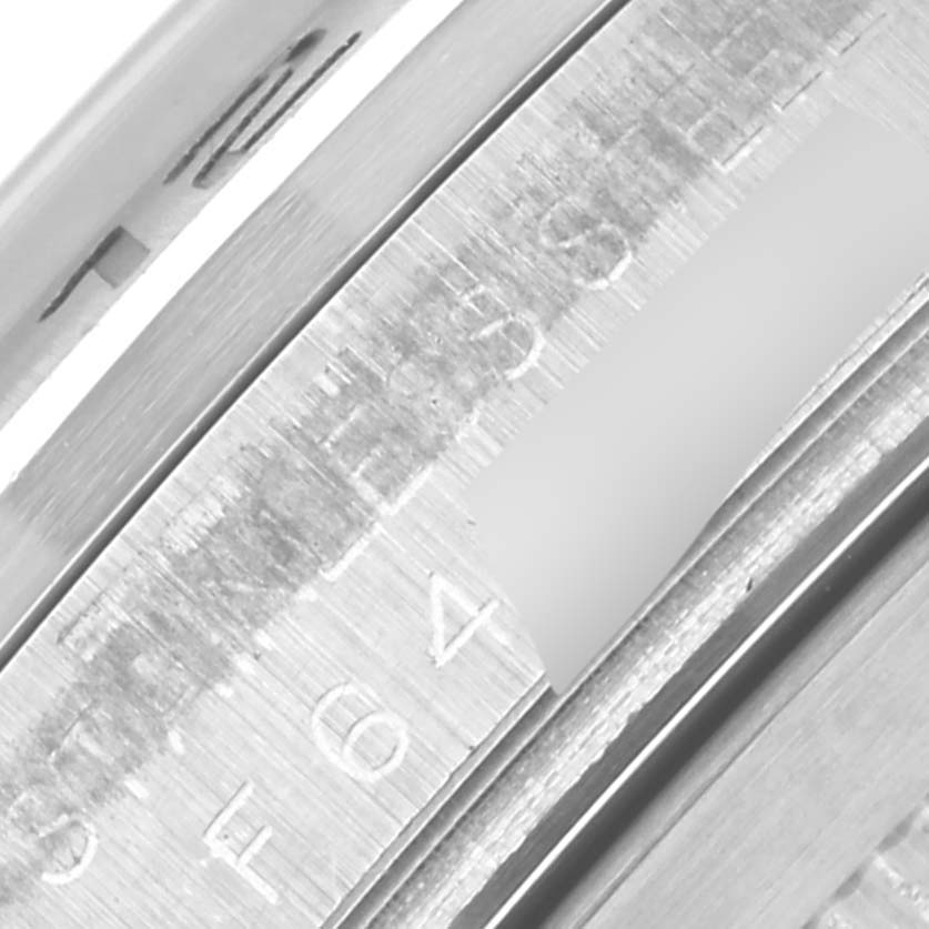 The image shows a close-up of the inner bezel with engravings from a Rolex Explorer 16570 Men's Stainless Steel White Dial 16570 Men's Stainless Steel White Dial model watch.