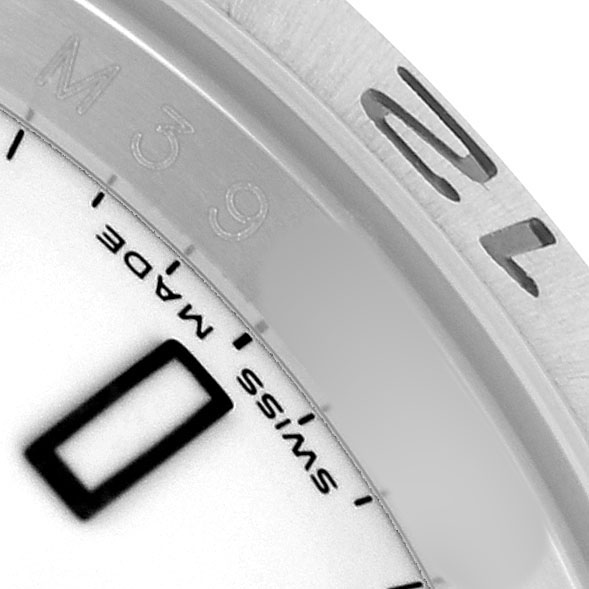 The image shows a close-up of the bezel and dial edge of a Rolex Explorer 16570 Men's Stainless Steel White Dial, focusing on the markings and "SWISS MADE" text.