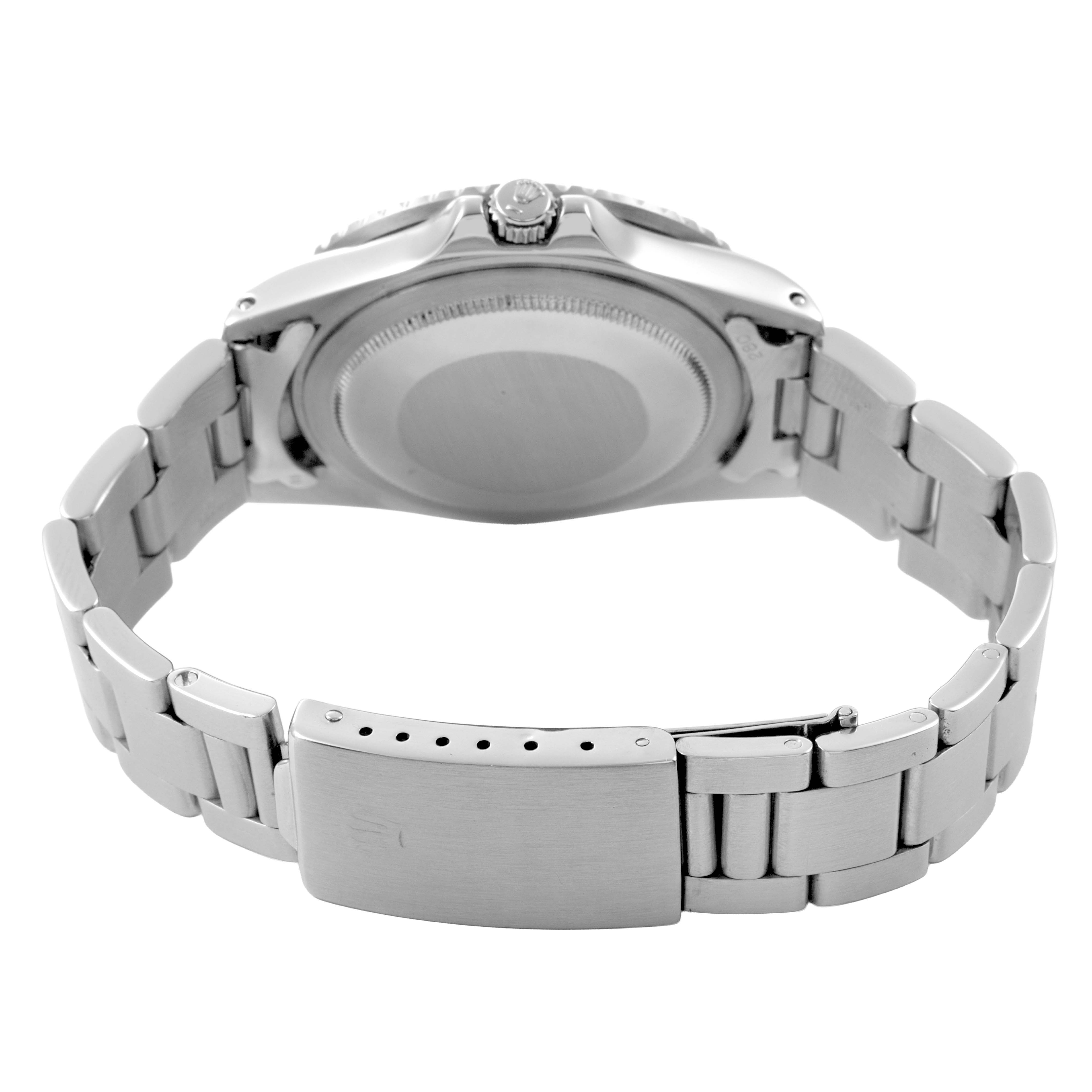 The image shows the back view of the Rolex Vintage Collection 1675 Men's Stainless Steel Black Dial watch, highlighting the case back, crown, and bracelet clasp.