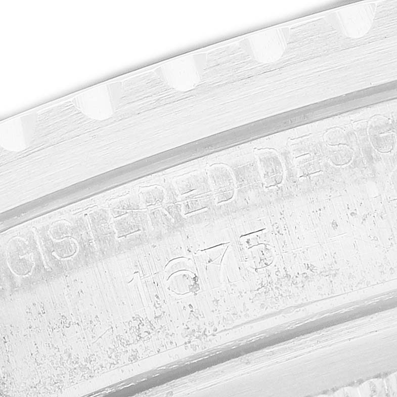 The image shows a close-up of the Rolex Vintage Collection 1675 Men's Stainless Steel Black Dial model's engraved case back.
