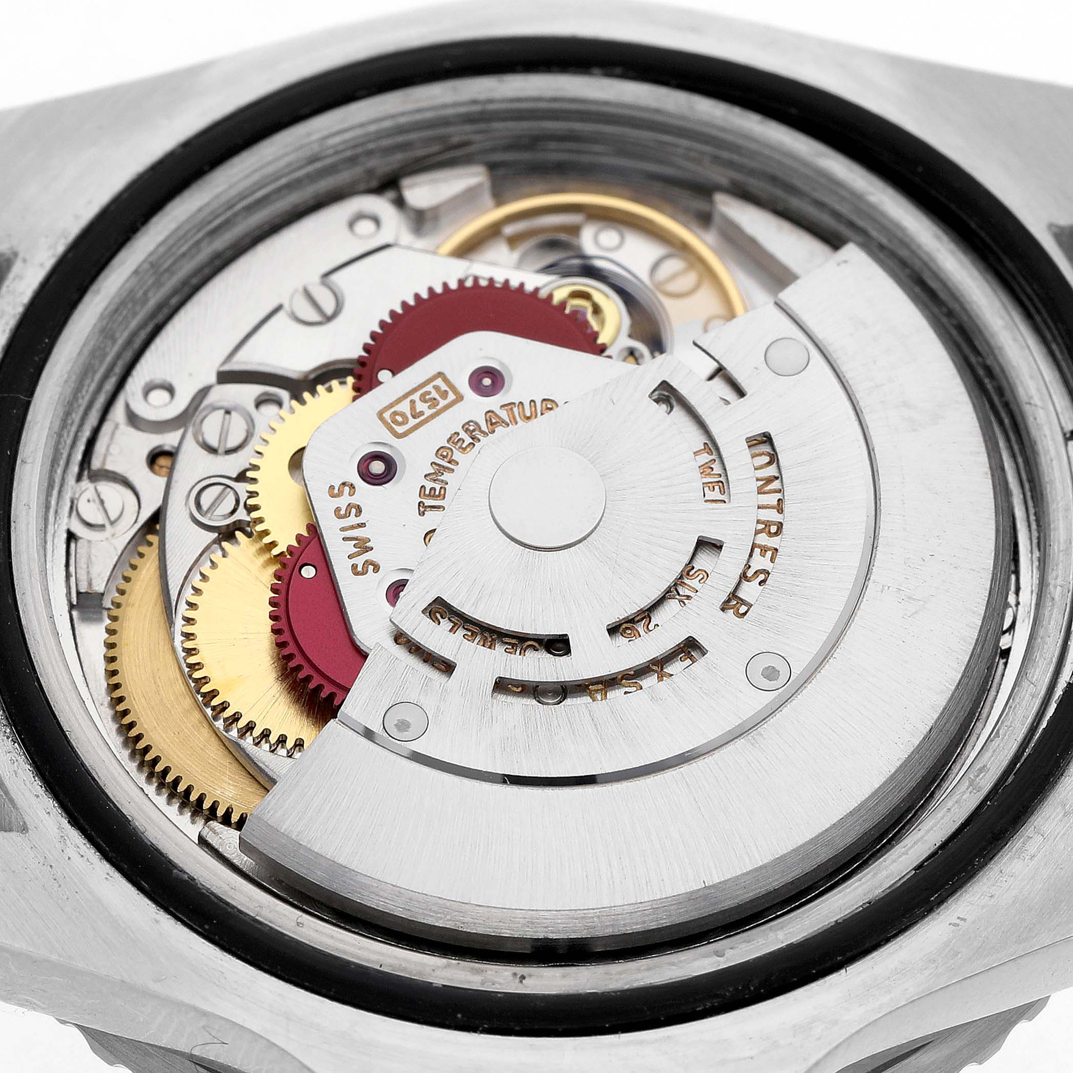 The image shows the exposed movement and rotor mechanism of a Vintage Collection Rolex watch from the back.