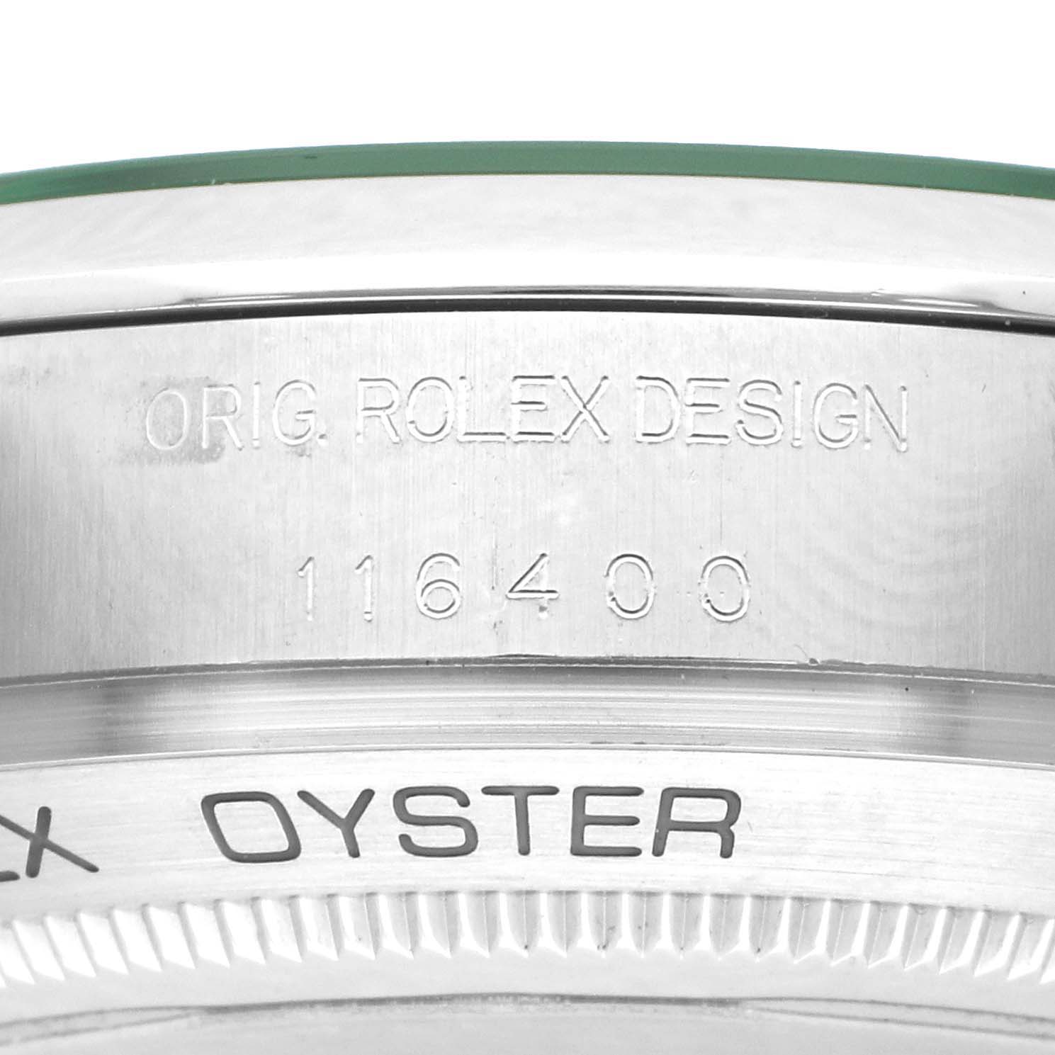 The image shows an angled close-up of the Rolex Milgauss 116400GV Men's Stainless Steel Black Dial model's outer case with visible engravings.