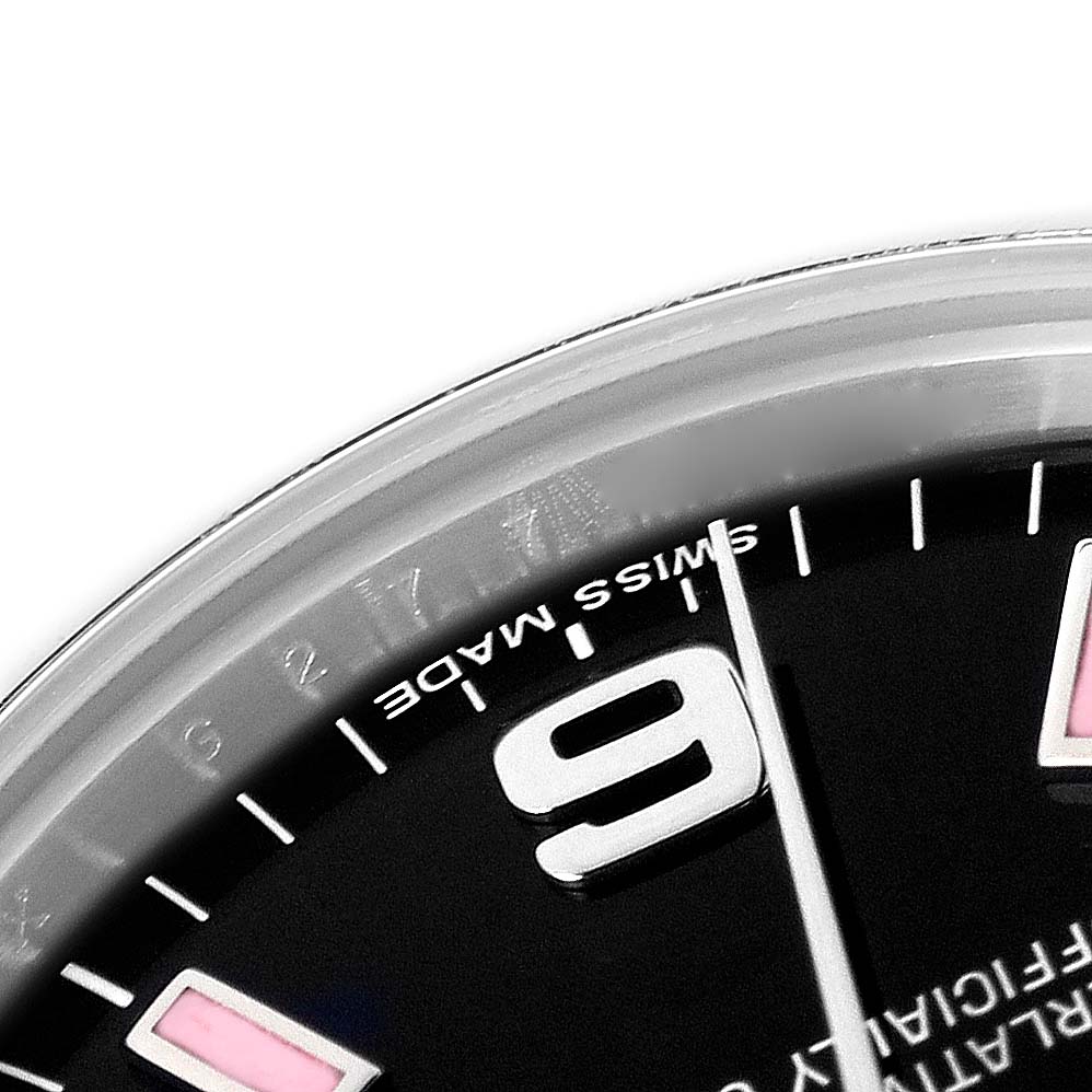 The image shows a close-up of the dial edge on a mid-size Rolex, highlighting the numeral 9 and hour markers.