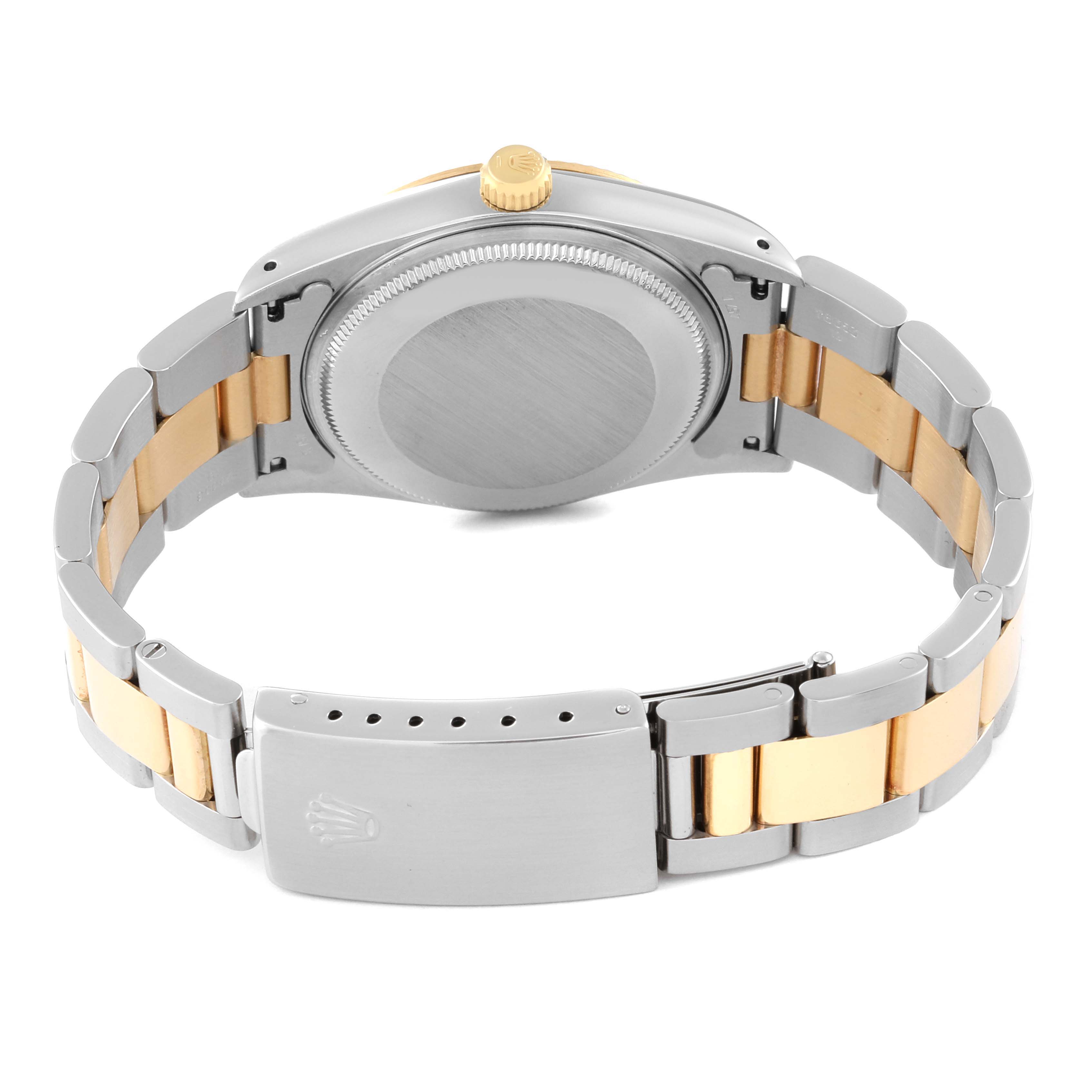 The image shows the back view of a Rolex Oyster Perpetual 14233 Men's Stainless Steel Champagne Dial 14233 Men's Stainless Steel Champagne Dial watch, highlighting the bracelet and the case back.