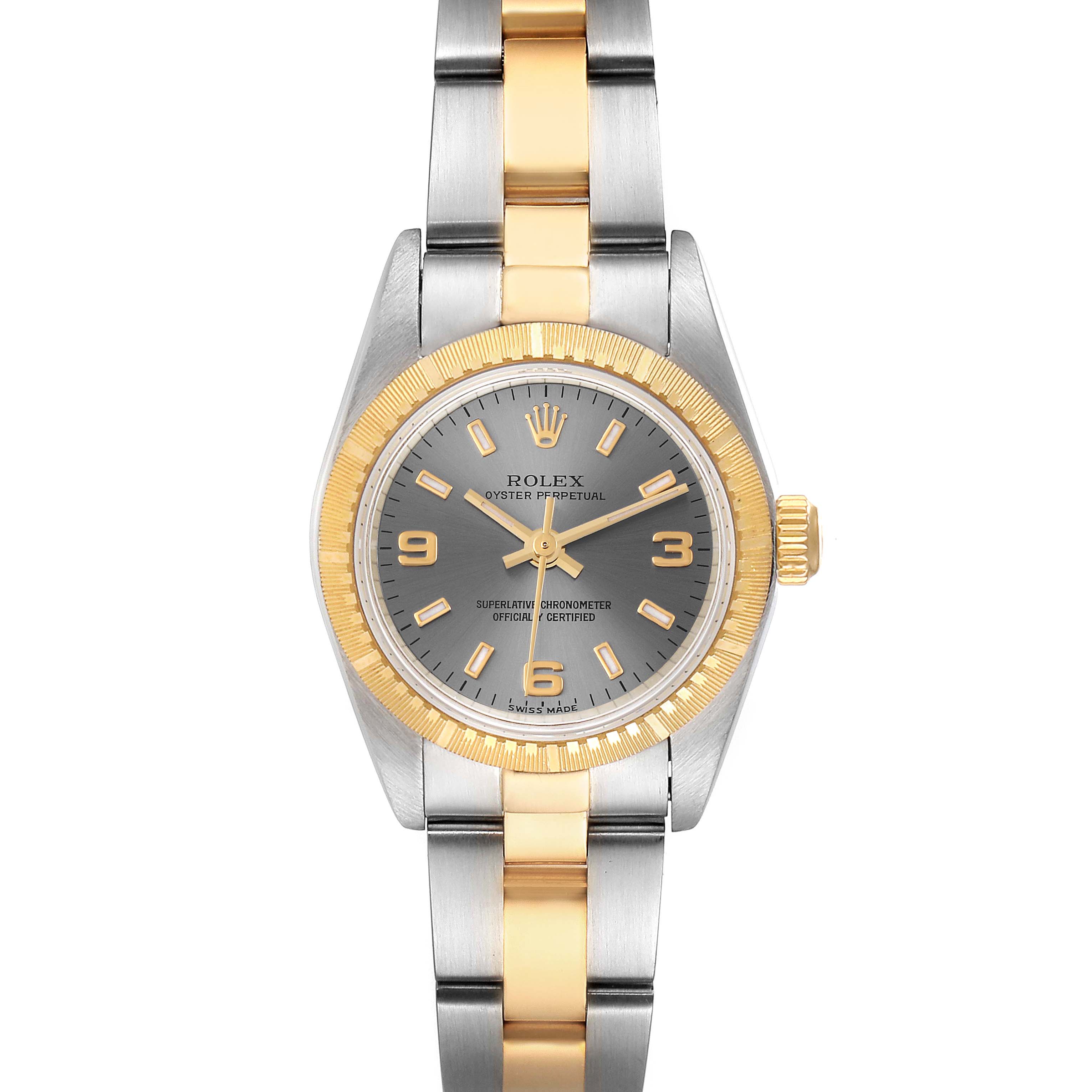 The image shows a front view of the Rolex Oyster Perpetual 76243 Women's Steel and Gold (two tone) Grey Dial 76243 Women's Steel and Gold (two tone) Grey Dial watch, highlighting its two-tone metal band and gray dial.