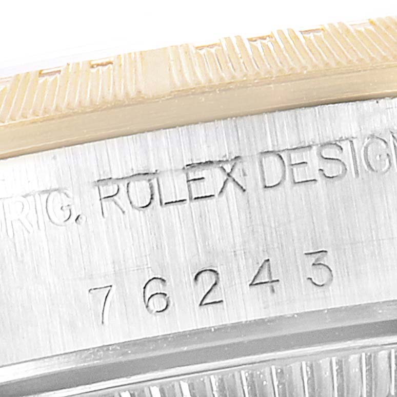 The image shows a close-up angle of the inscription on the case side of a Rolex Oyster Perpetual 76243 Women's Steel and Gold (two tone) Grey Dial 76243 Women's Steel and Gold (two tone) Grey Dial watch, displaying the model number.