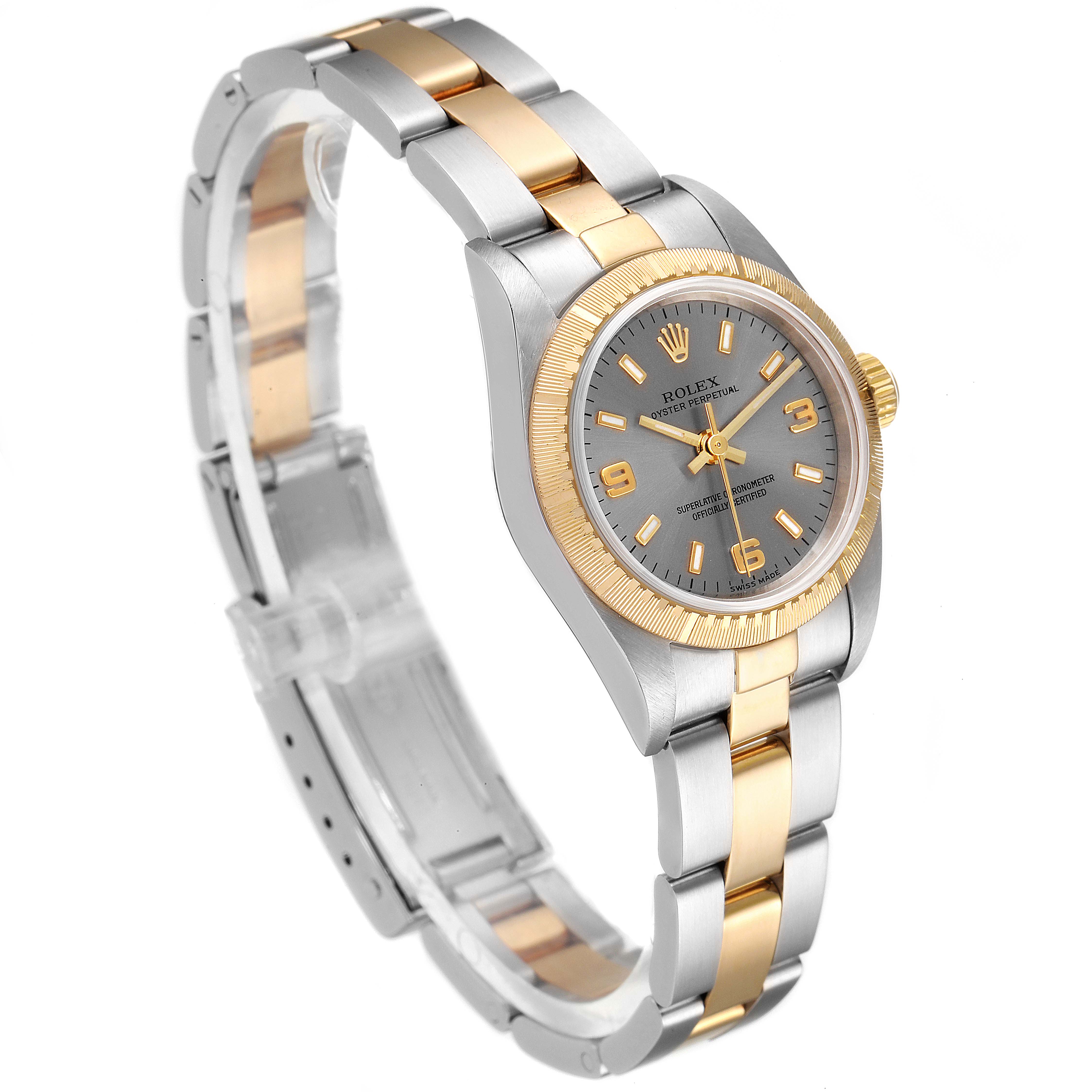 This image shows the Rolex Oyster Perpetual 76243 Women's Steel and Gold (two tone) Grey Dial 76243 Women's Steel and Gold (two tone) Grey Dial watch at an angled side view, highlighting the watch face and metal bracelet.