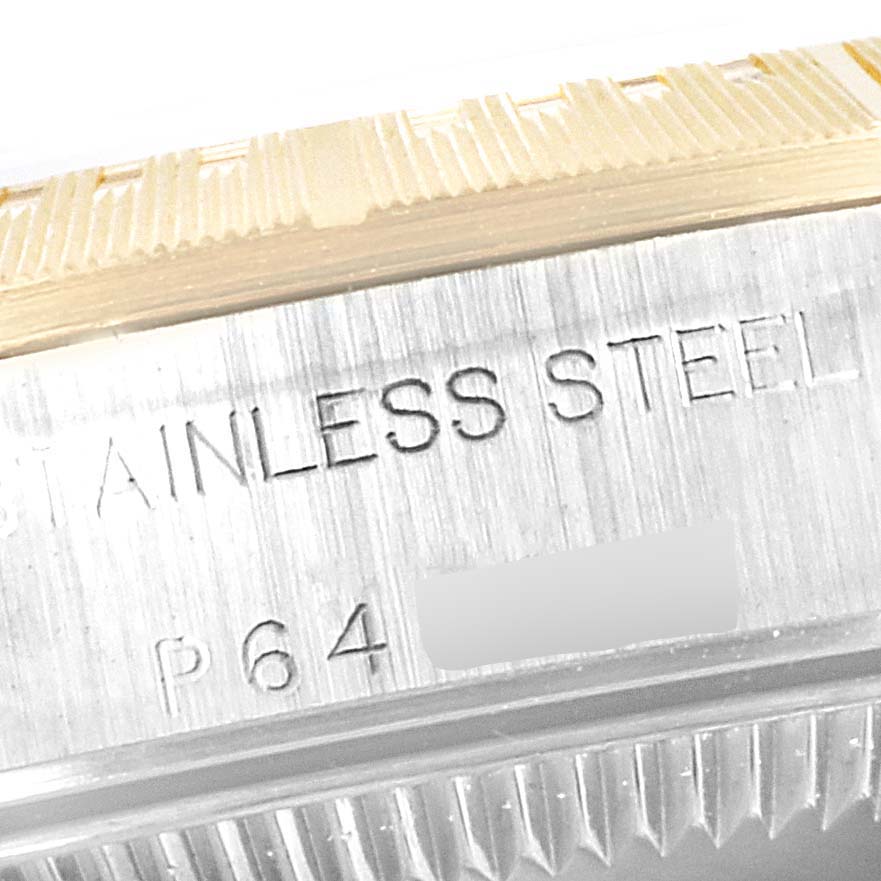 The image shows a close-up of the stainless steel case and part of the bezel of a Rolex Oyster Perpetual 76243 Women's Steel and Gold (two tone) Grey Dial 76243 Women's Steel and Gold (two tone) Grey Dial watch.