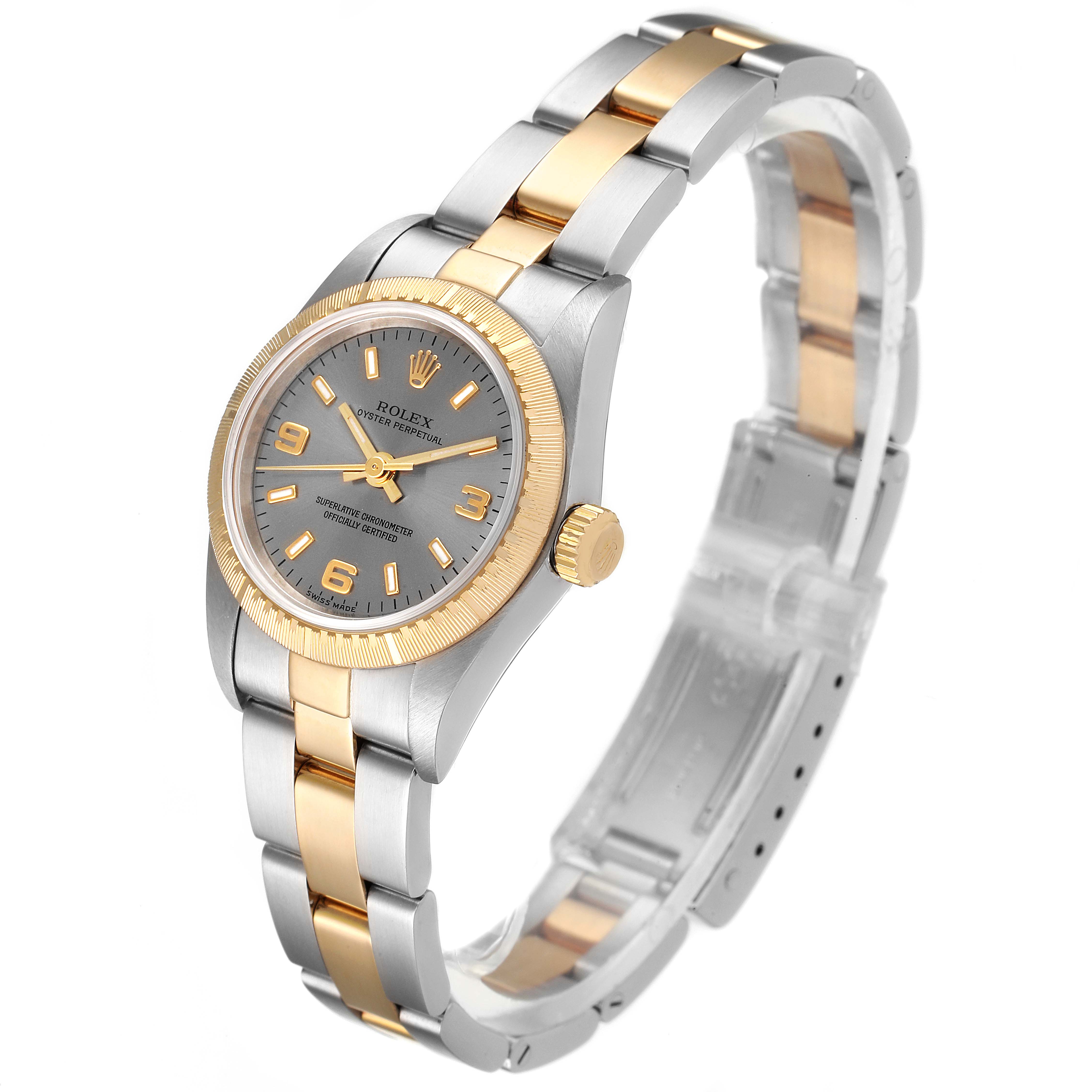 The Rolex Oyster Perpetual 76243 Women's Steel and Gold (two tone) Grey Dial 76243 Women's Steel and Gold (two tone) Grey Dial watch is shown at a three-quarter angle, highlighting the dual-tone bracelet and gray dial.