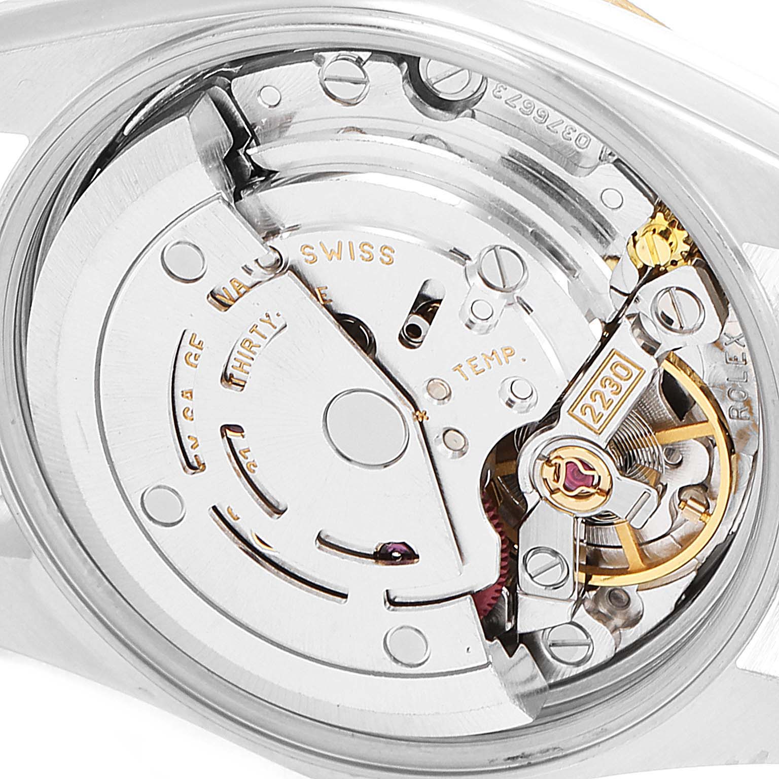 The image shows a close-up view of the movement mechanism inside a Rolex Oyster Perpetual 76243 Women's Steel and Gold (two tone) Grey Dial 76243 Women's Steel and Gold (two tone) Grey Dial watch.