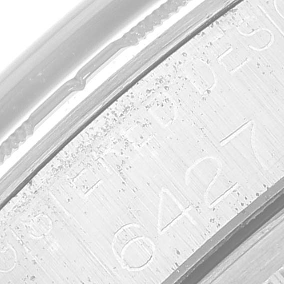 The image shows a close-up angle of a Rolex Vintage Collection 6427 Men's Stainless Steel Silver Dial watch, focusing on the engraved side of the case.