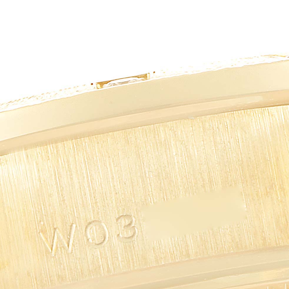 This image shows a close-up of the clasp engraving on a Rolex President 69288 Women
s White Gold Champagne Dial 69288 Women
s White Gold Champagne Dial model watch.