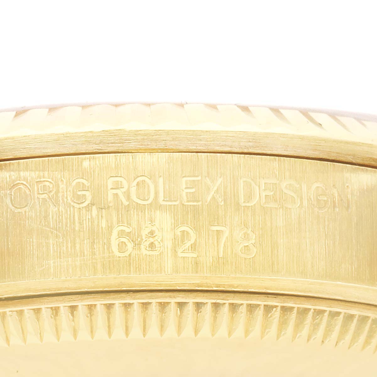 The image shows the side of a Rolex President 68278 Women's Yellow Gold White Dial 68278 Women's Yellow Gold White Dial model, highlighting the engraved design number.