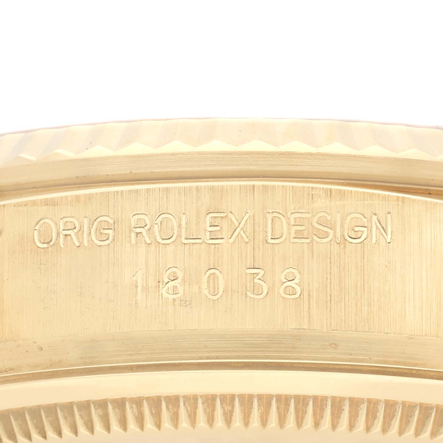 The image shows an engraved side of the Rolex President 18038 Men
s Yellow Gold Champagne Dial 18038 Men
s Yellow Gold Champagne Dial model, highlighting the design number.