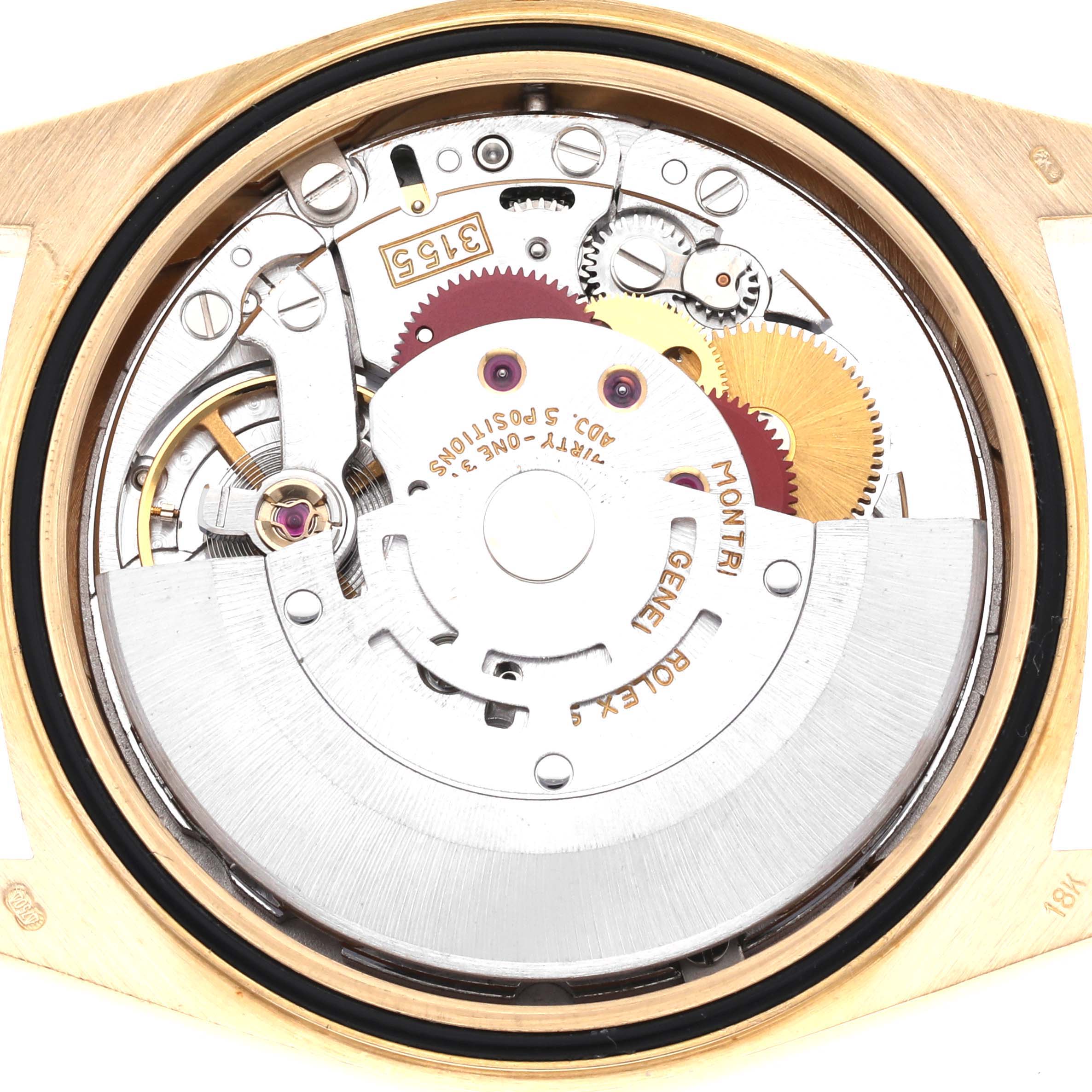 The image shows the movement of a Rolex President 18238 Men
s Yellow Gold Champagne Dial 18238 Men
s Yellow Gold Champagne Dial watch viewed from the back, highlighting gears and the rotor.