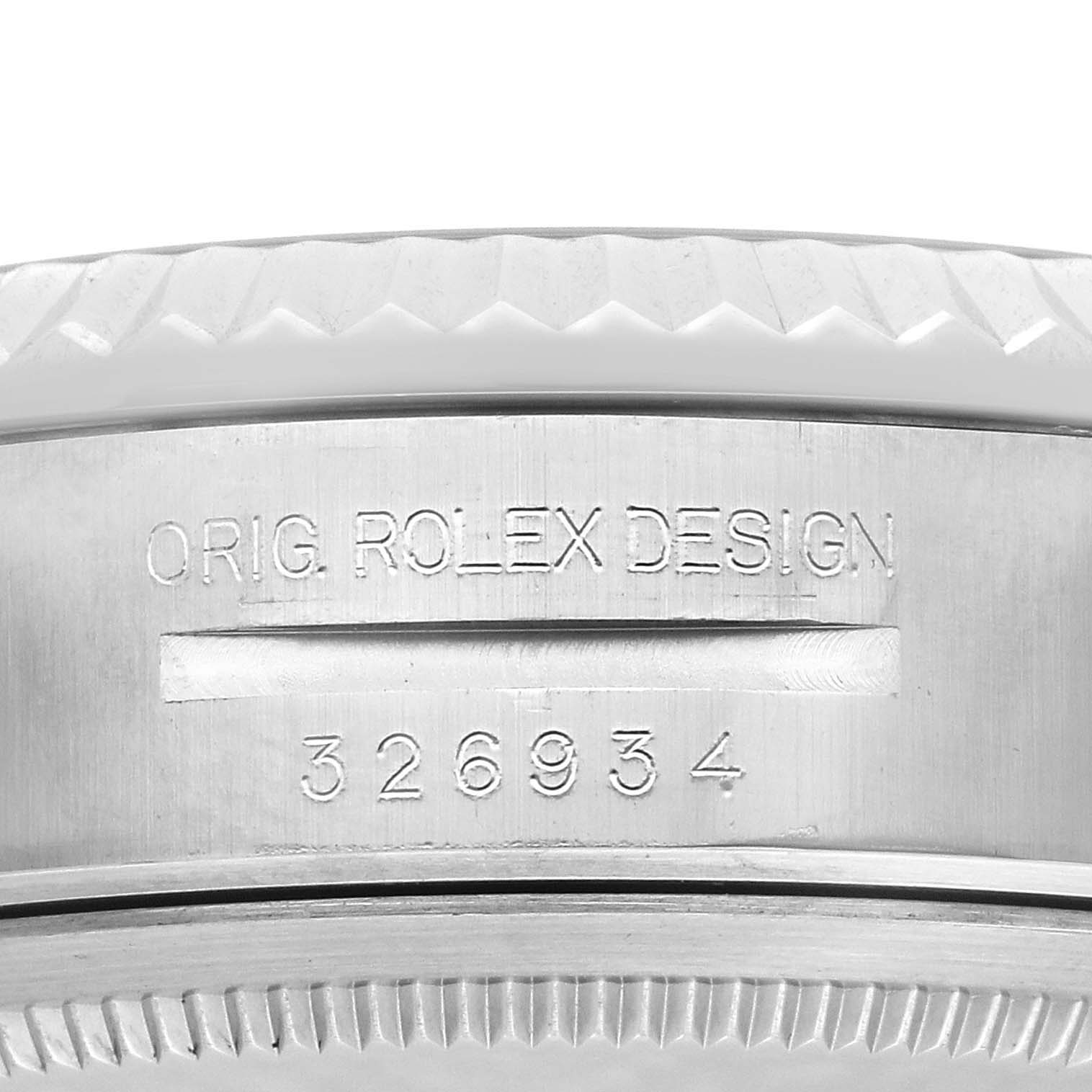 The image shows the side profile of the Rolex Sky-Dweller 326934 Men's Stainless Steel Blue Dial watch, focusing on the engraved model number and design details.