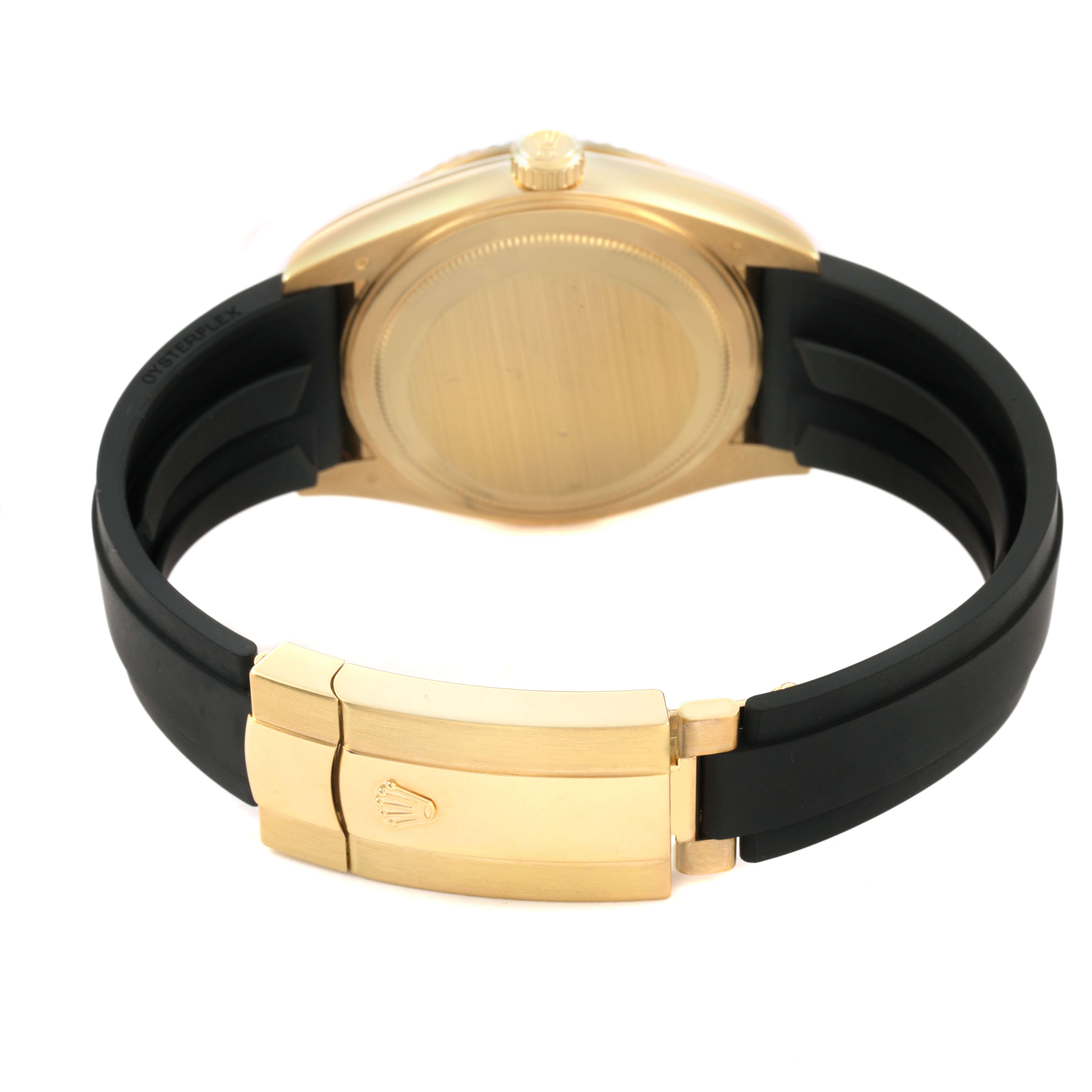 The image shows the back and clasp of a Rolex Sky-Dweller 326238 Men's Yellow Gold White Dial watch, featuring a gold case and a black rubber strap.