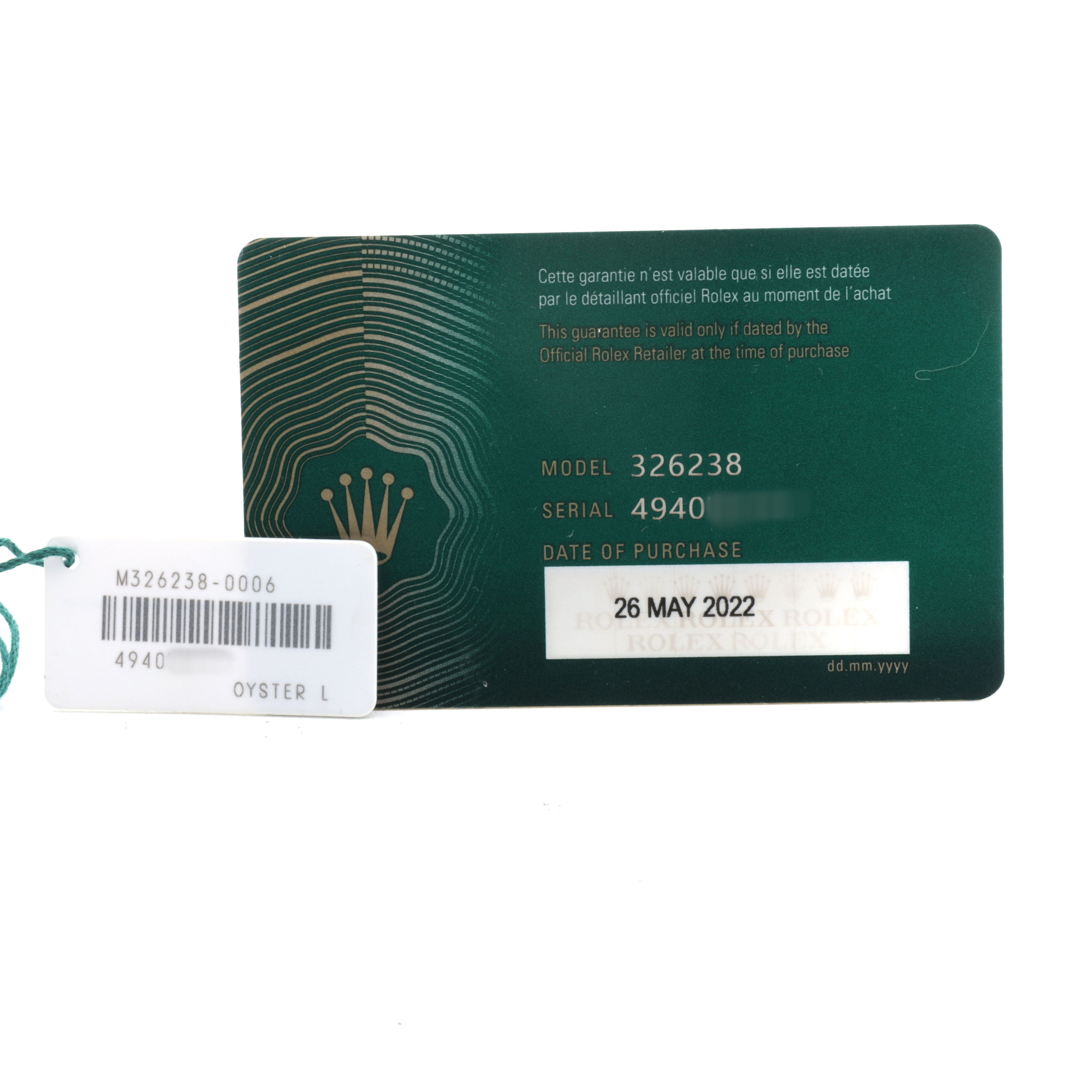 The image shows the warranty card and tag of a Rolex Sky-Dweller 326238 Men's Yellow Gold White Dial, displaying model, serial number, and purchase date.