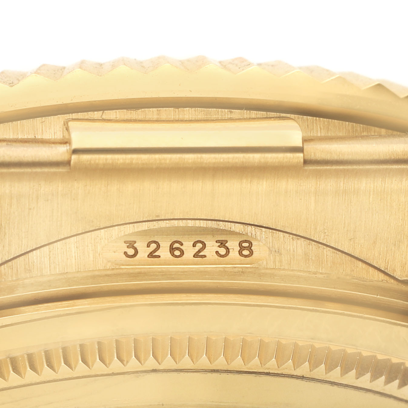 The image shows a close-up view of a Rolex Sky-Dweller 326238 Men's Yellow Gold White Dial watch's model number on the back case edge.