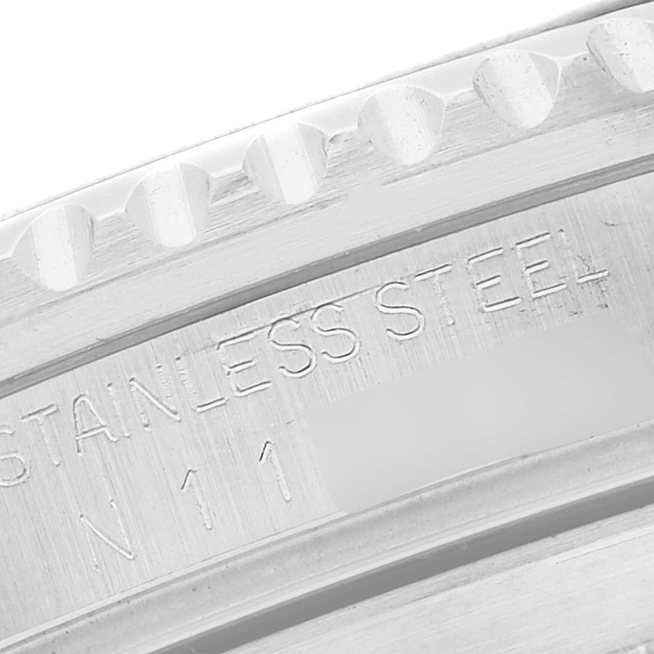 The image shows a close-up of the stainless steel casing with engraved markings on a Rolex Submariner 16610 Men
s Stainless Steel Black Dial 16610 Men
s Stainless Steel Black Dial watch.