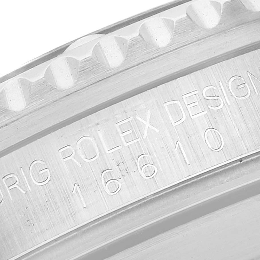This image shows a close-up of the engraved inner bezel and case part of the Rolex Submariner 16610 Men
s Stainless Steel Black Dial 16610 Men
s Stainless Steel Black Dial model 16610.