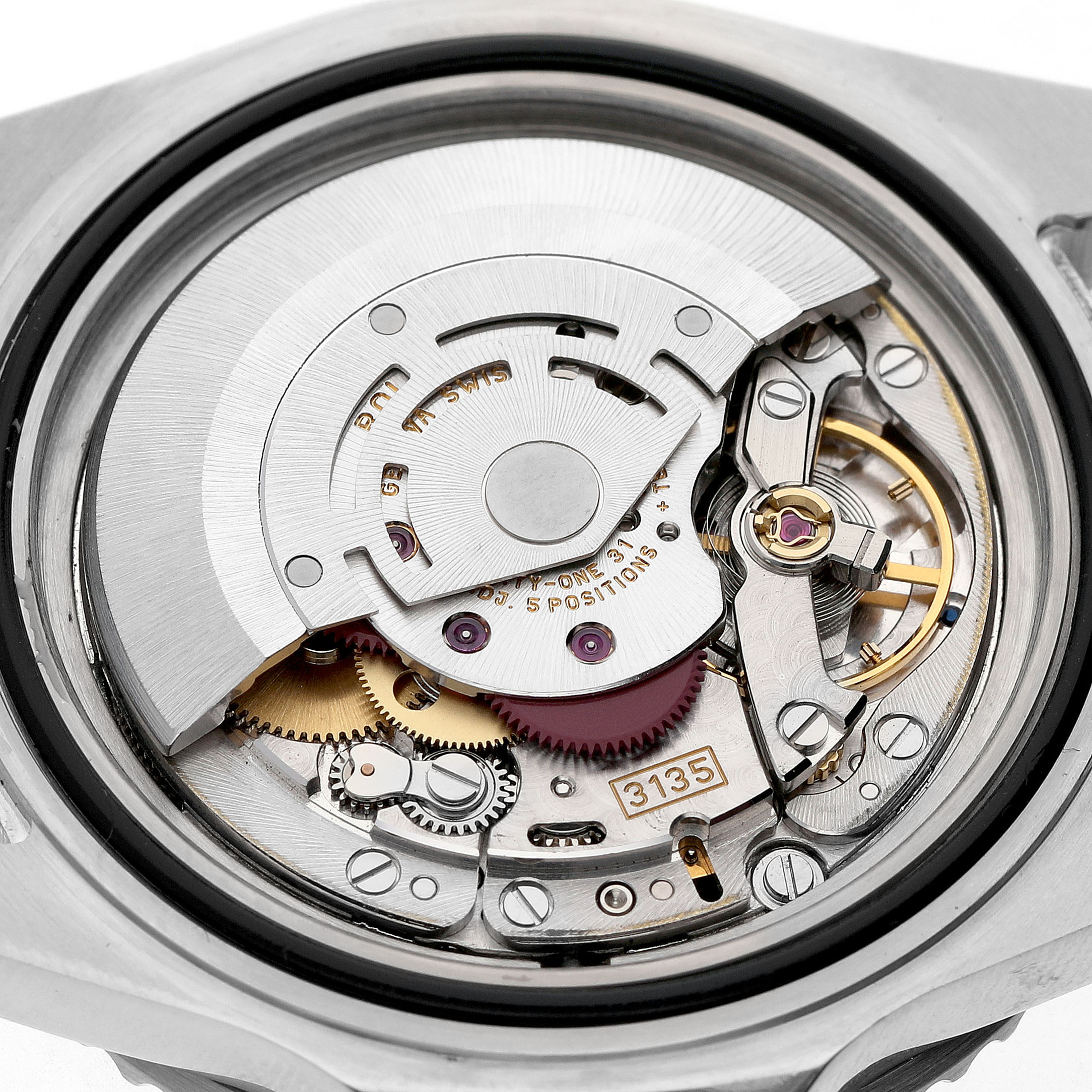 The image shows the intricate internal mechanism of a Rolex Submariner 16610 Men's Stainless Steel Black Dial watch, focusing on its movement and gears from the back.