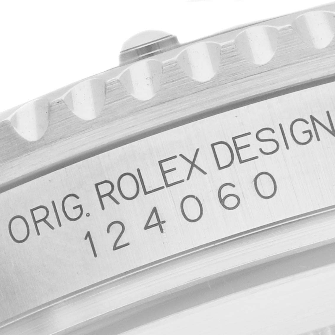 The image shows a close-up of the side of a Rolex Submariner 124060 Men's Stainless Steel Black Dial watch, displaying the model number and part of the bezel.