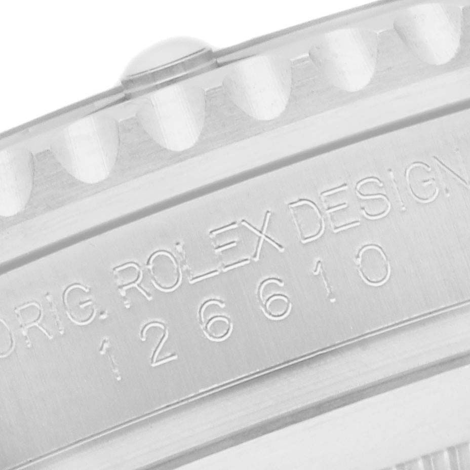 The image shows a close-up of the edge and engraving on the case side of a Rolex Submariner 126610 Men's Stainless Steel Black Dial watch.