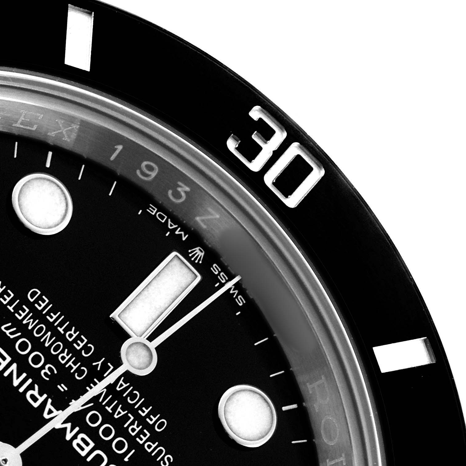 This image shows a close-up of the Rolex Submariner 126610 Men's Stainless Steel Black Dial watch face, focusing on the bezel and dial details.