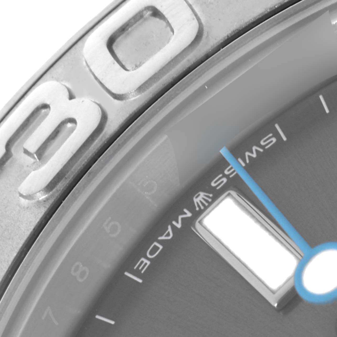 The image shows a close-up of the Rolex Yacht-Master 268622 Men's Stainless Steel Grey Dial 268622 Men's Stainless Steel Grey Dial's bezel, dial, and a blue hand.