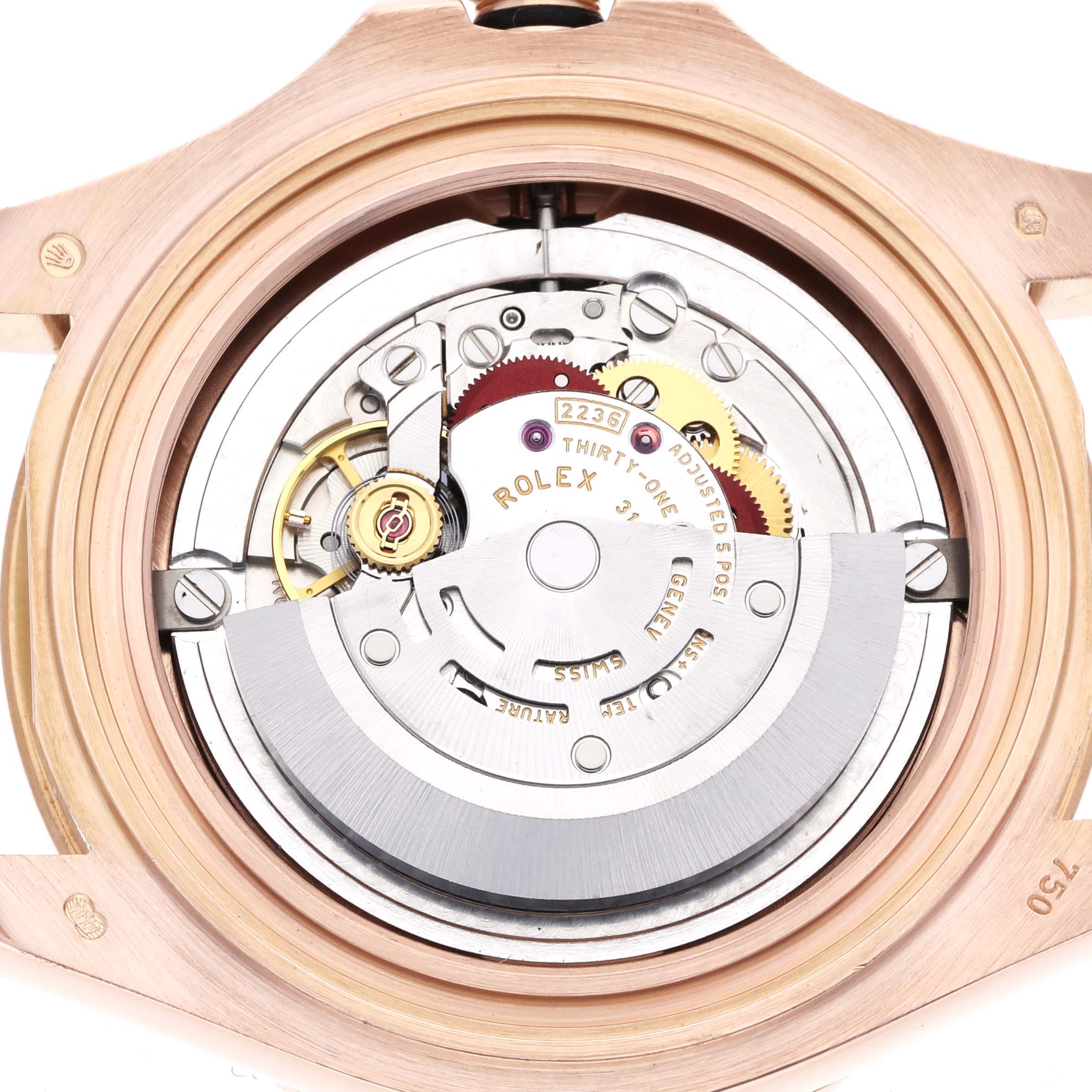 The image shows the exposed movement of a Rolex Yacht-Master 268655 Men's Rose Gold Black Dial watch from the back, focusing on the intricate gears and rotor.