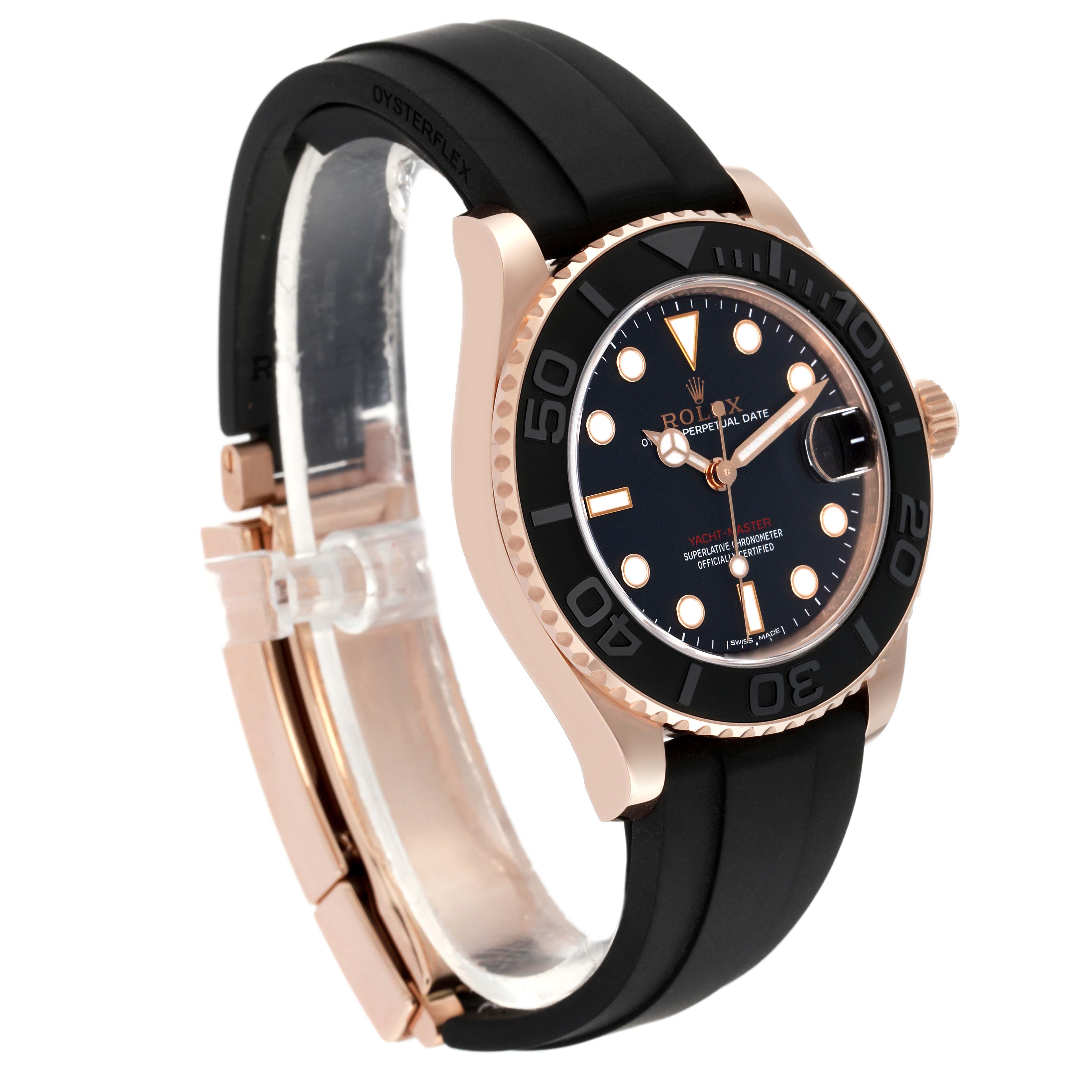 The Yacht-Master by Rolex is shown at a three-quarter angle, highlighting its black dial, rose gold case, and black Oysterflex strap.