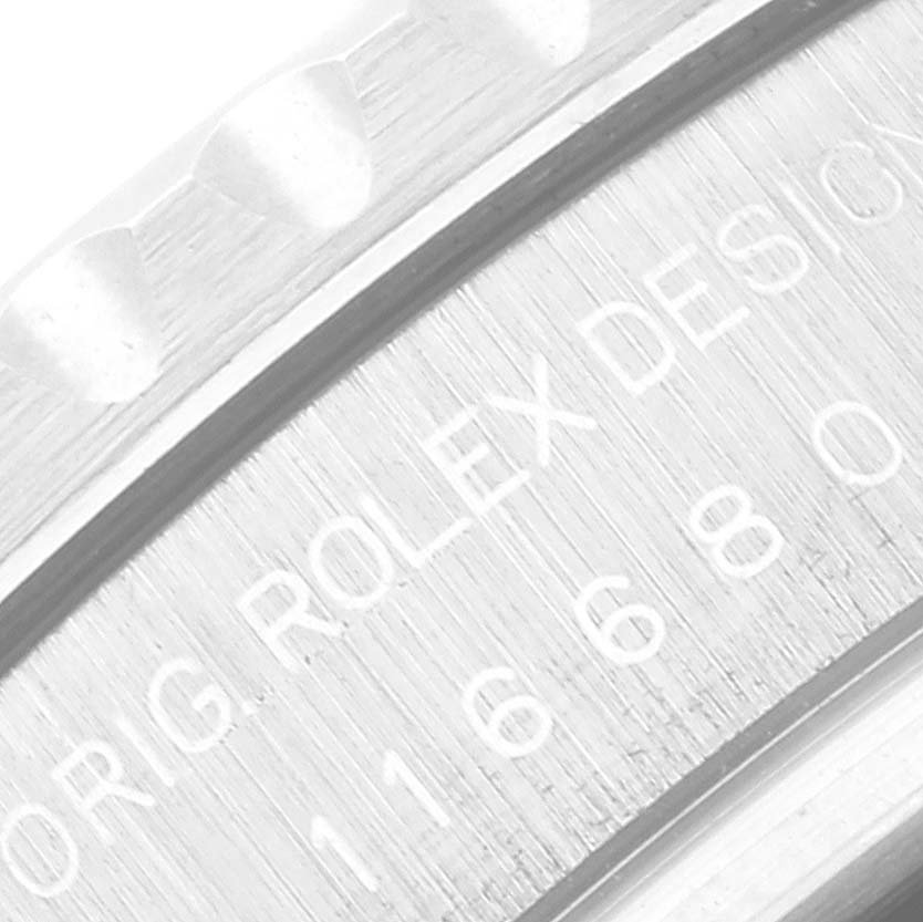 This close-up image shows the engraved serial number and "Rolex" branding on the bezel of the Rolex Yacht-Master 116680 Men
s Stainless Steel White Dial 116680 Men
s Stainless Steel White Dial watch.