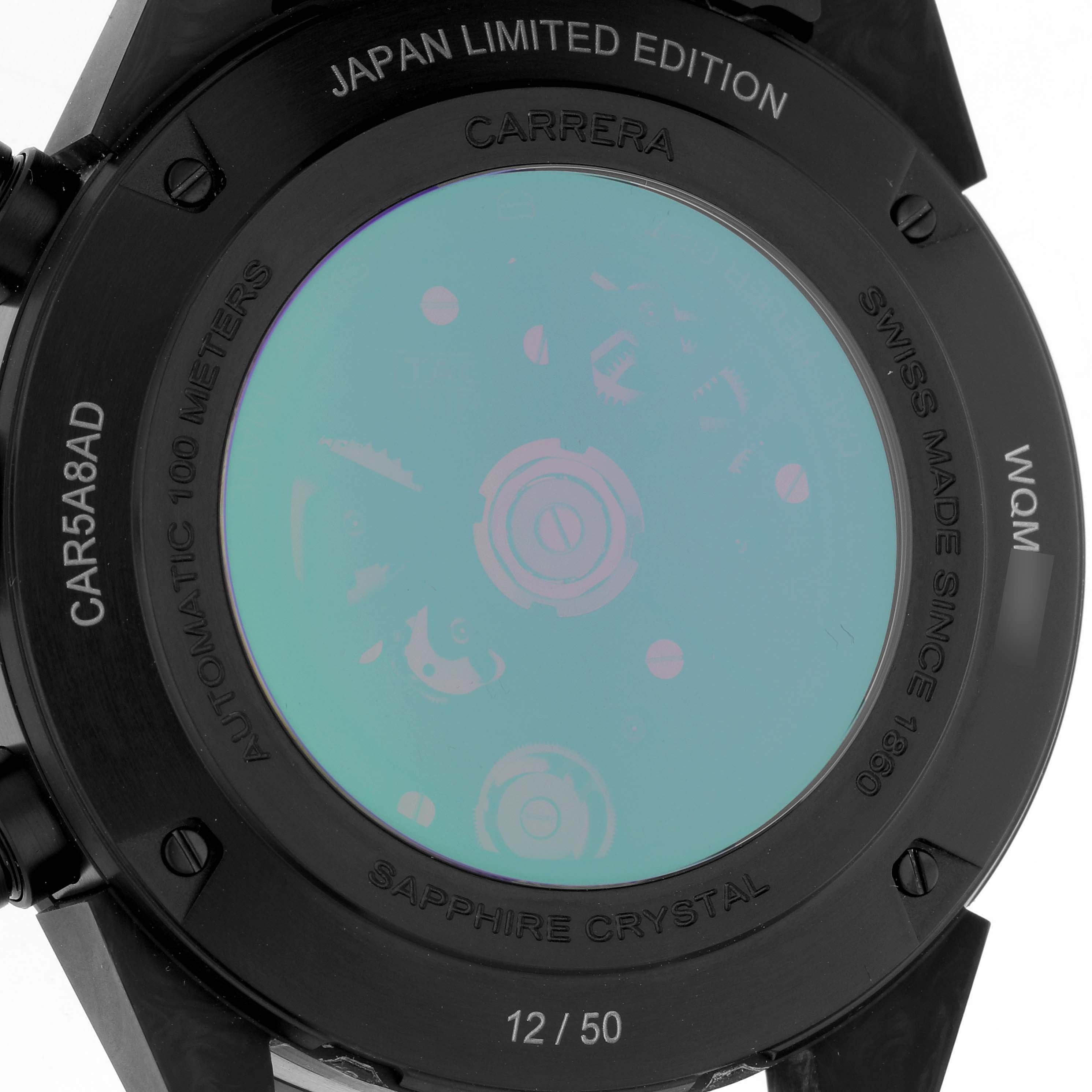 The image shows the back case of the Tag Heuer Carrera CAR5A8AD Men
s Titanium Black Dial CAR5A8AD Men
s Titanium Black Dial watch, with inscriptions on the rim.