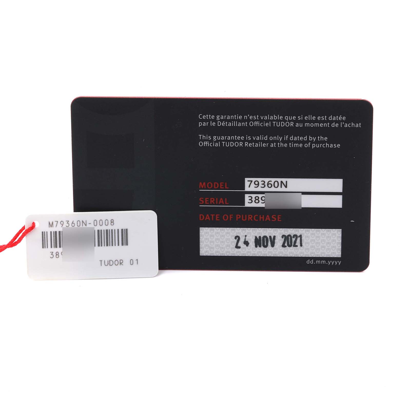 This image shows a warranty card for the Tudor Heritage Black Bay model, displaying model, serial number, and purchase date.